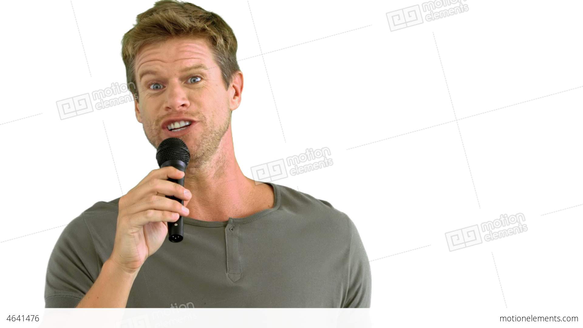 Man With Microphone Singing On White Background Stock video footage ...
