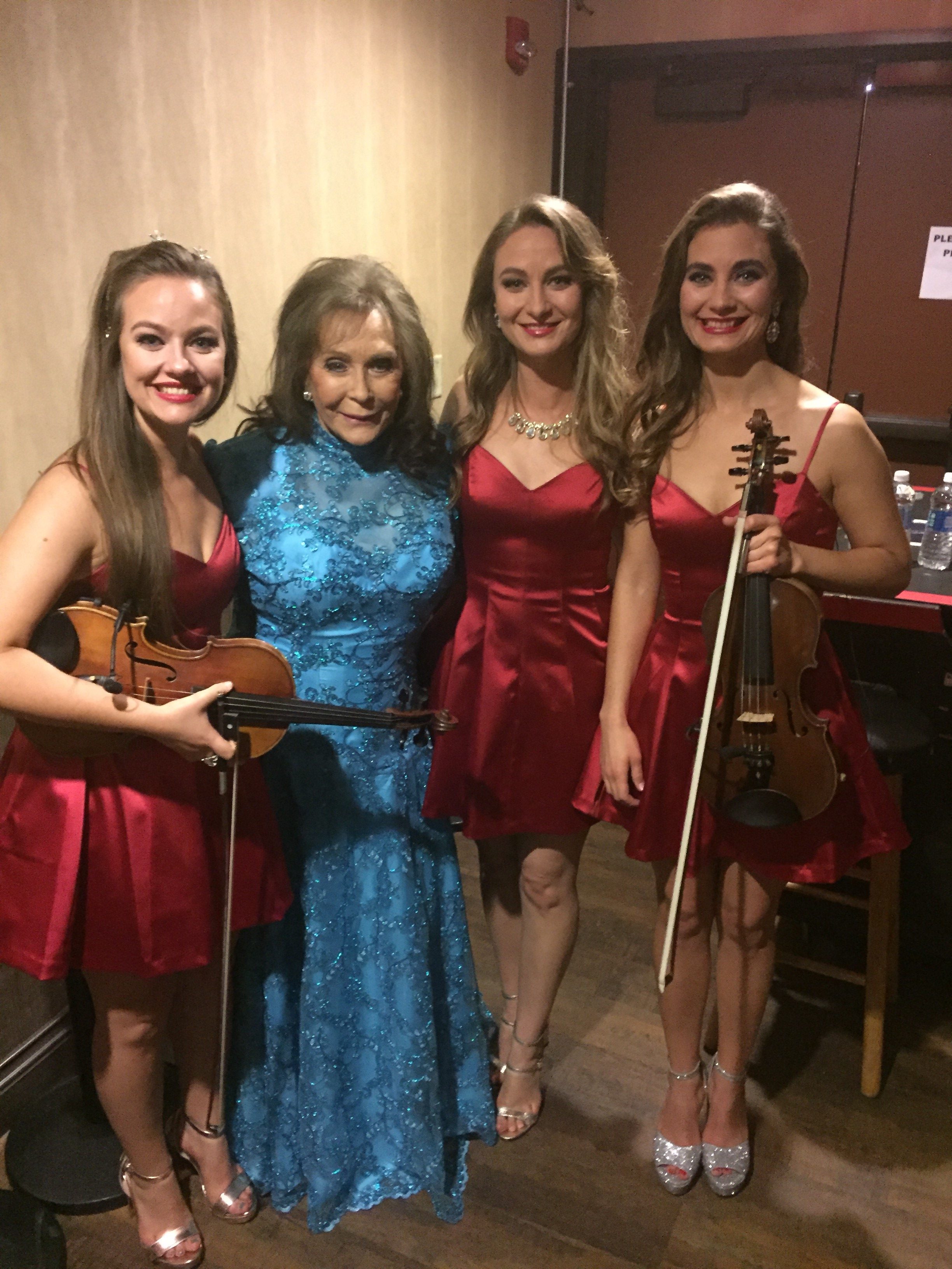 The Quebe Sisters Pose With Loretta Lynn For CMA Country Christmas ...