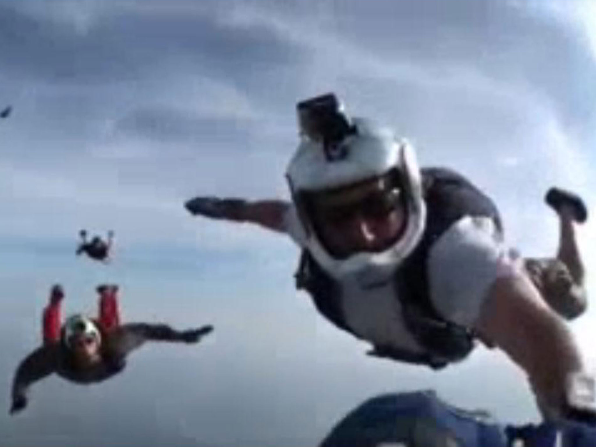Unconscious skydiver is saved by friends mid-air after being knocked ...