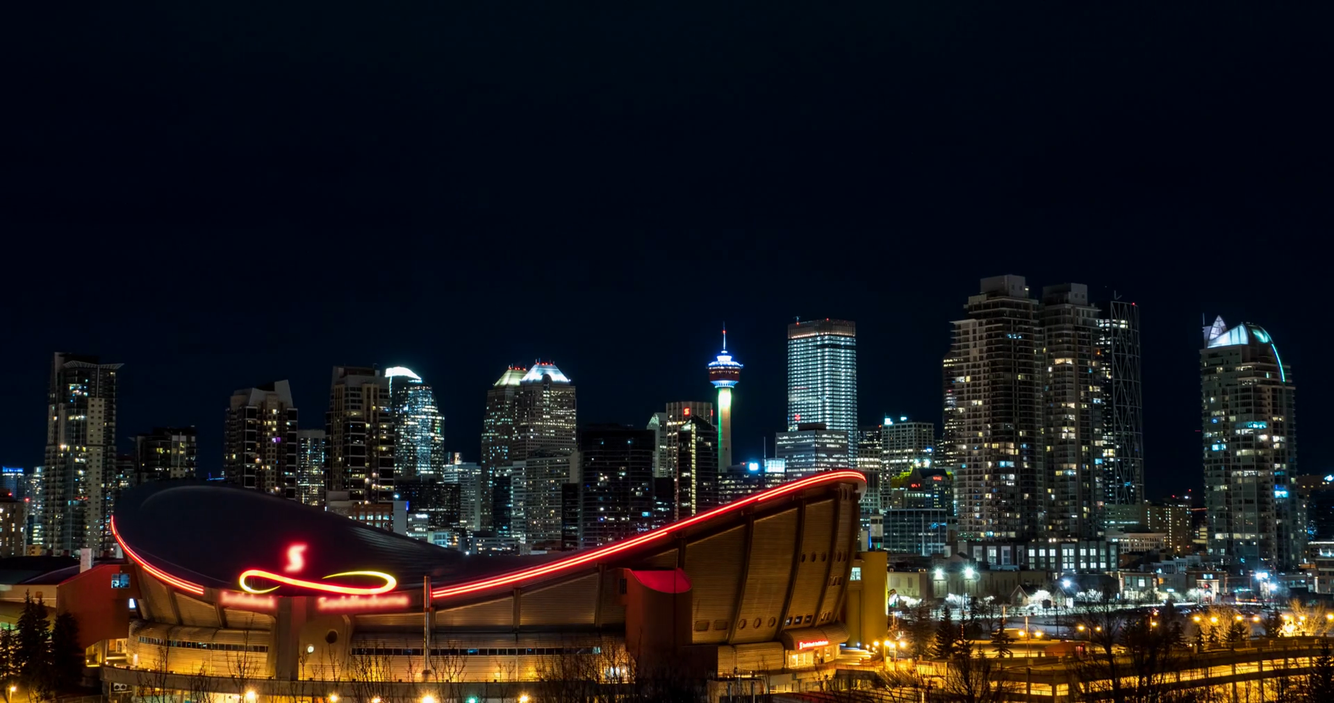 Hyperlapse Of Calgary Skyline And Saddledome Stadium at night. Stock ...