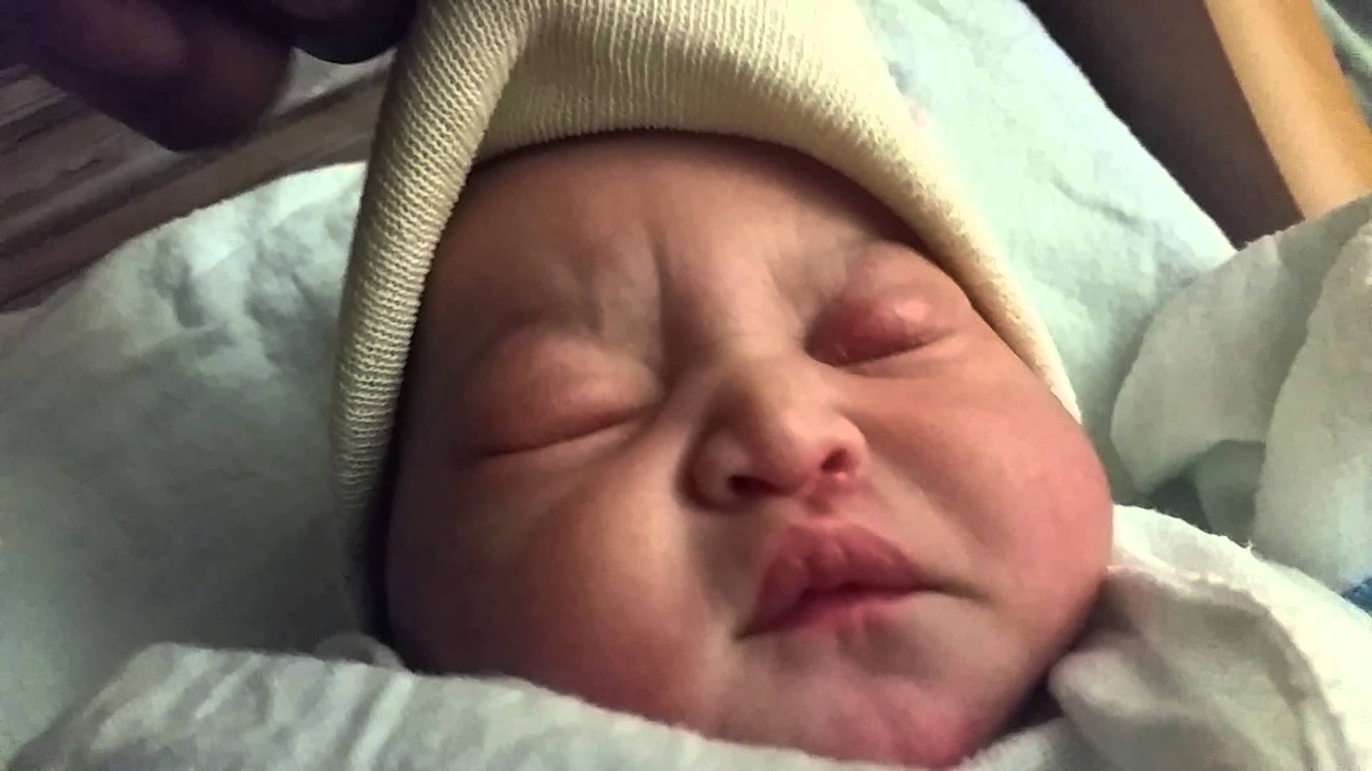 New born baby selena sleeping with a mad face blowing kisses - YouTube