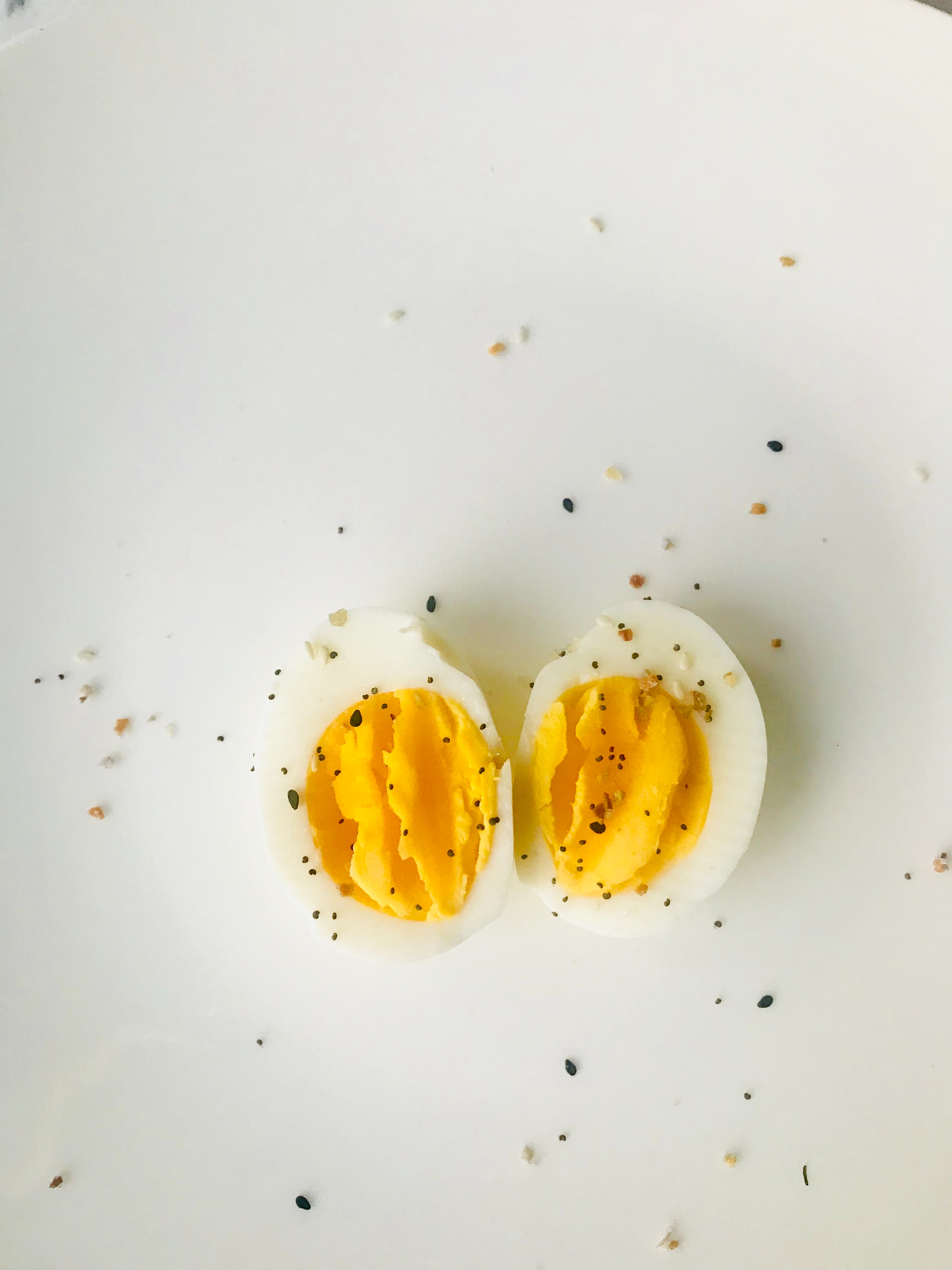Sliced boiled egg on white plate photo