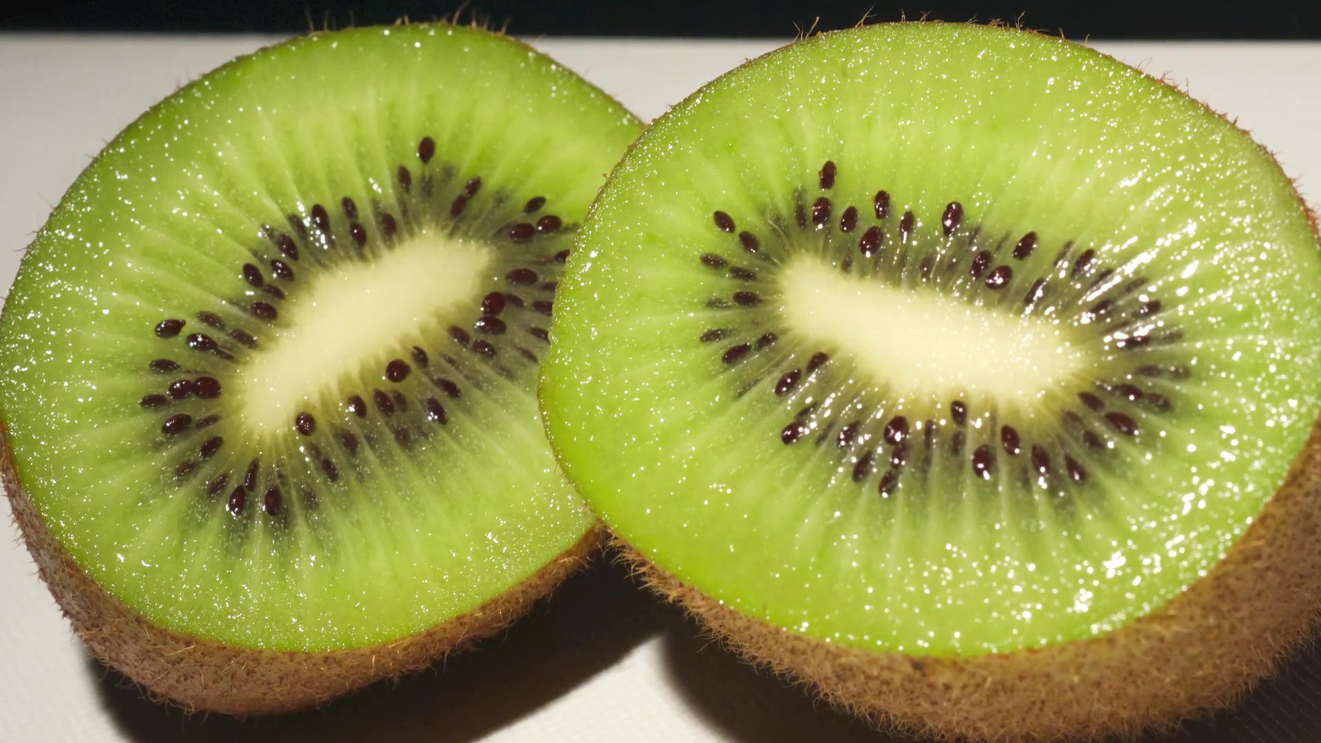 Ripe Kiwi fruit freshly sliced and ready to be eaten. Stock Video ...