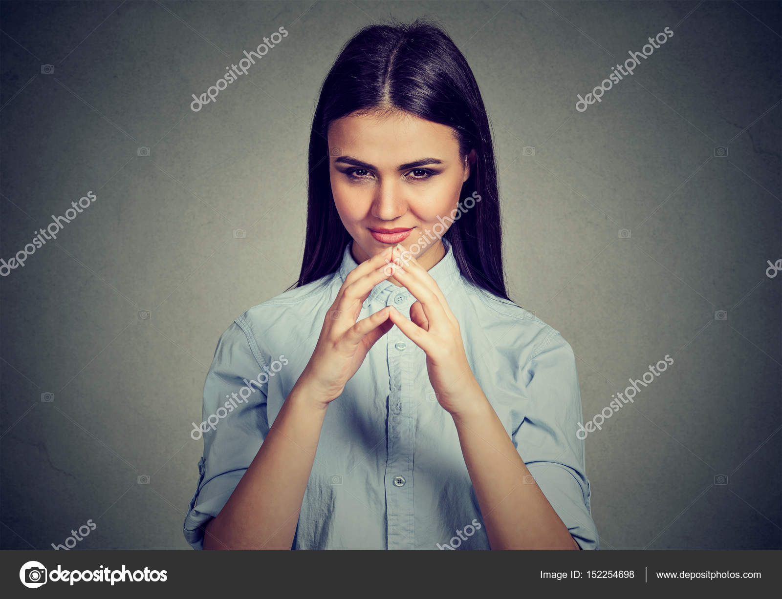 Let me think. Attractive woman looking with sly expression, having ...