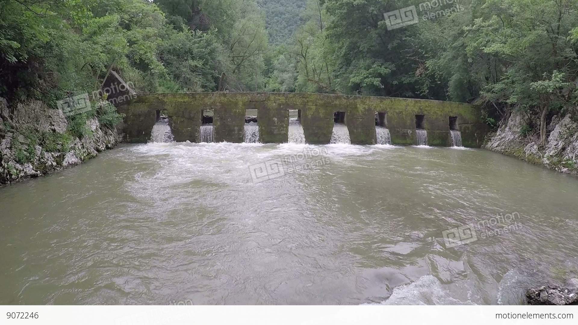 Camera Flying Over Small River Dam, And Upstream Stock video footage ...