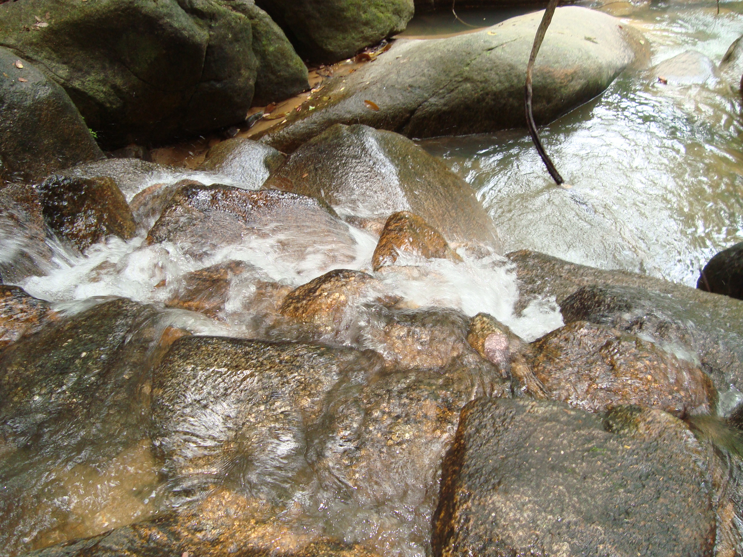 Small waterfall over boulders photo
