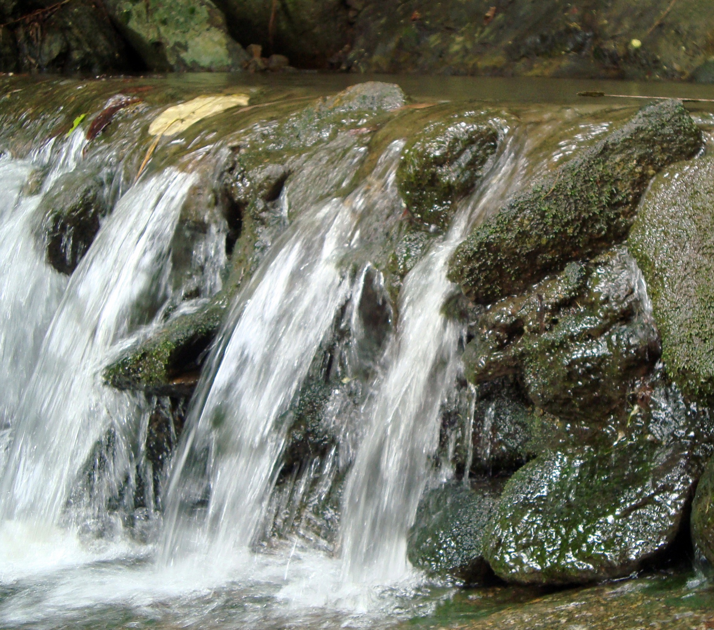 Small waterfall over rocks photo