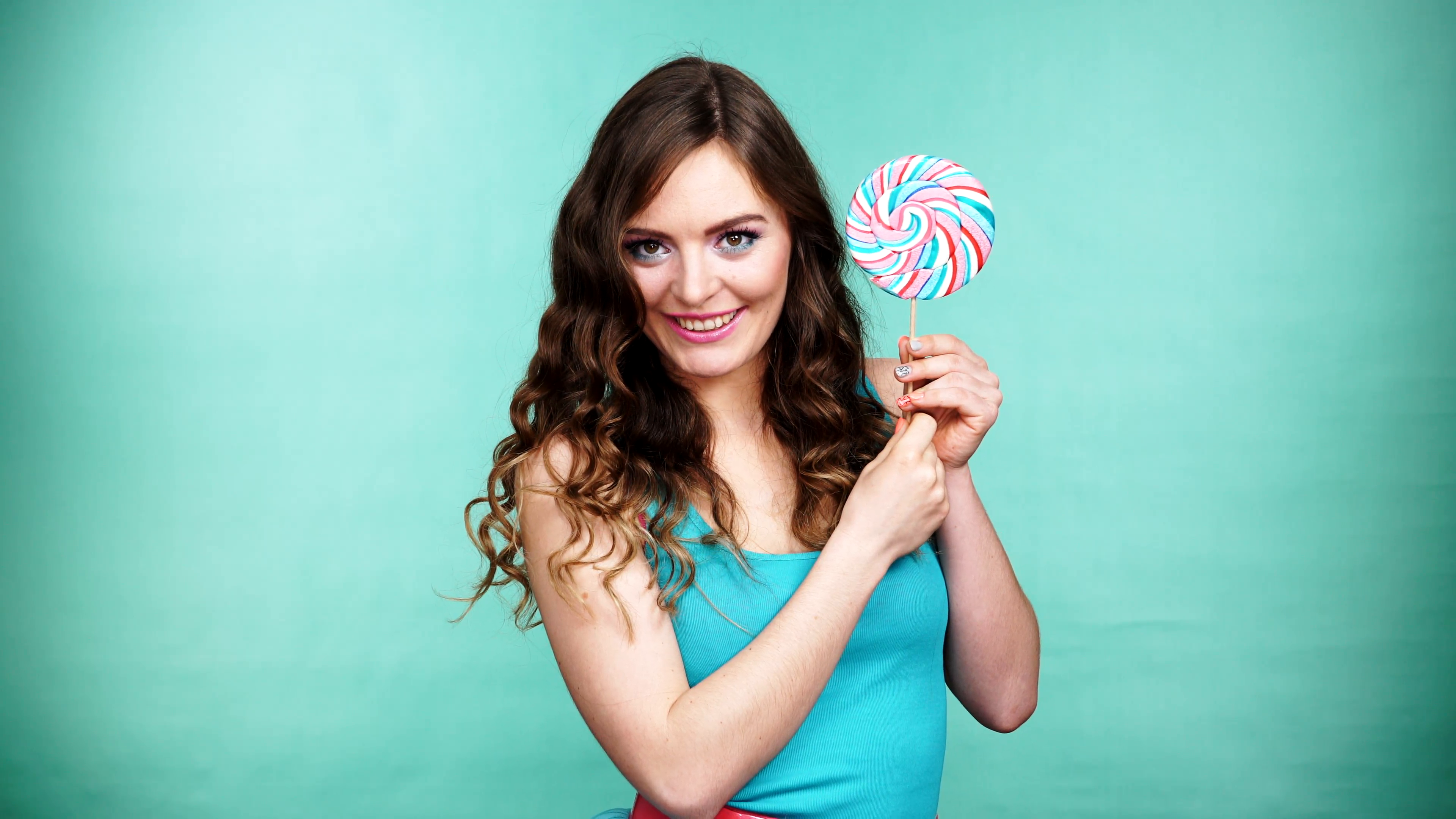 Woman smiling girl with lollipop candy on green 4K Stock Video ...