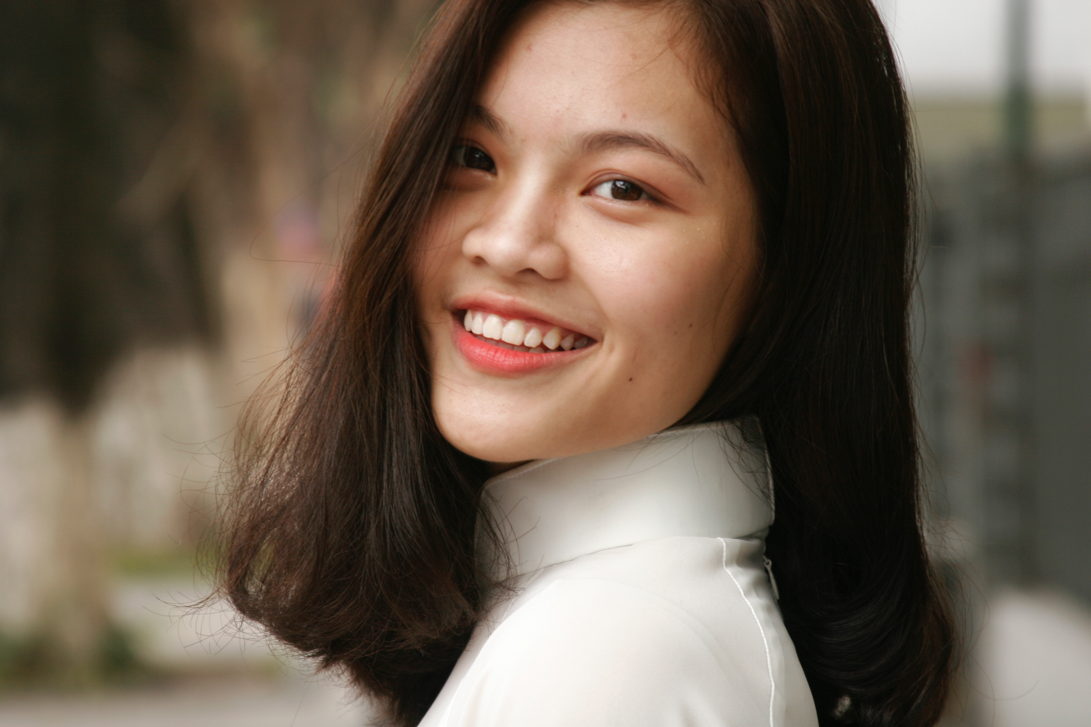 Smiling woman wearing white turtleneck top photo
