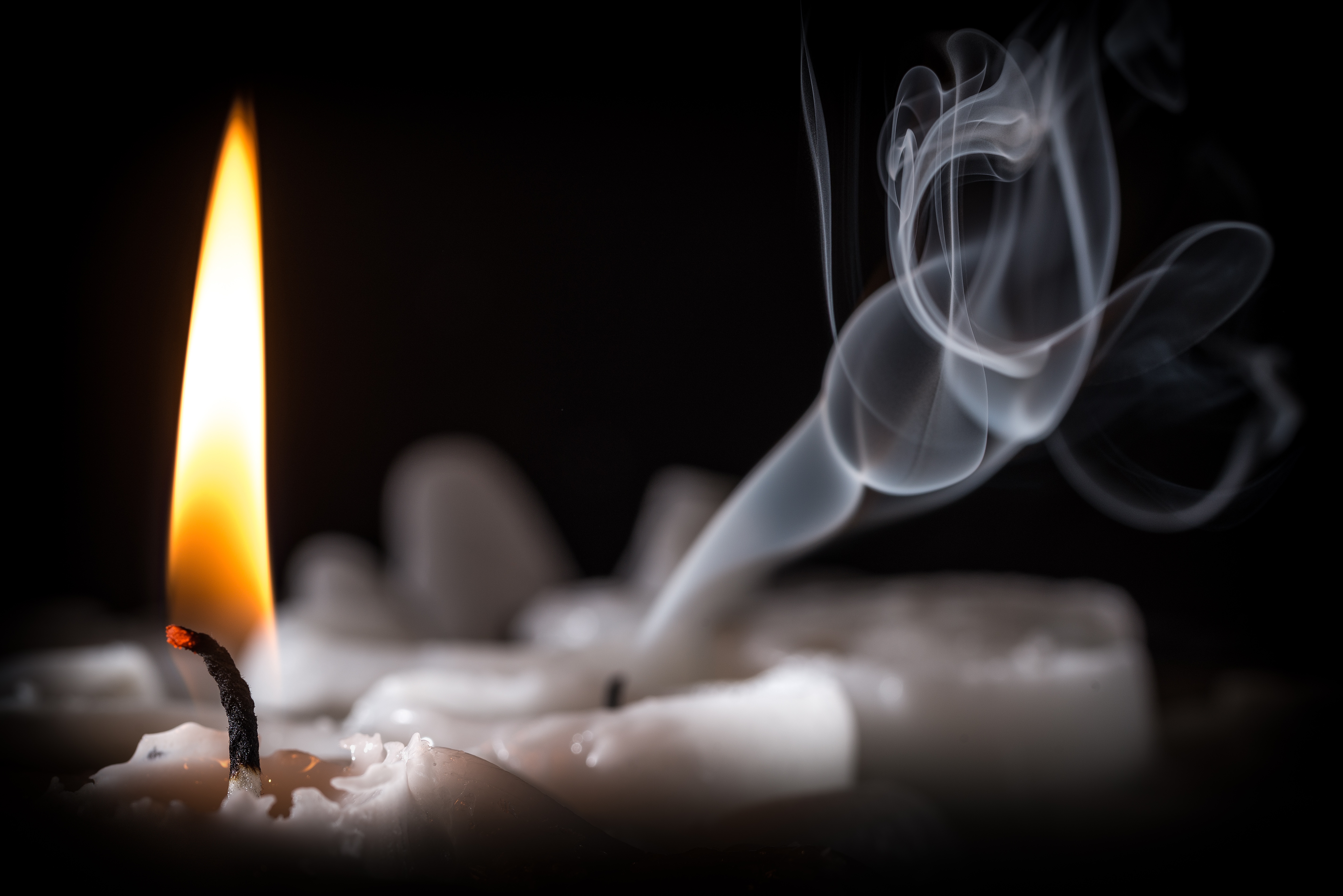 Fire burning candle with smoke on a black background wallpapers and ...