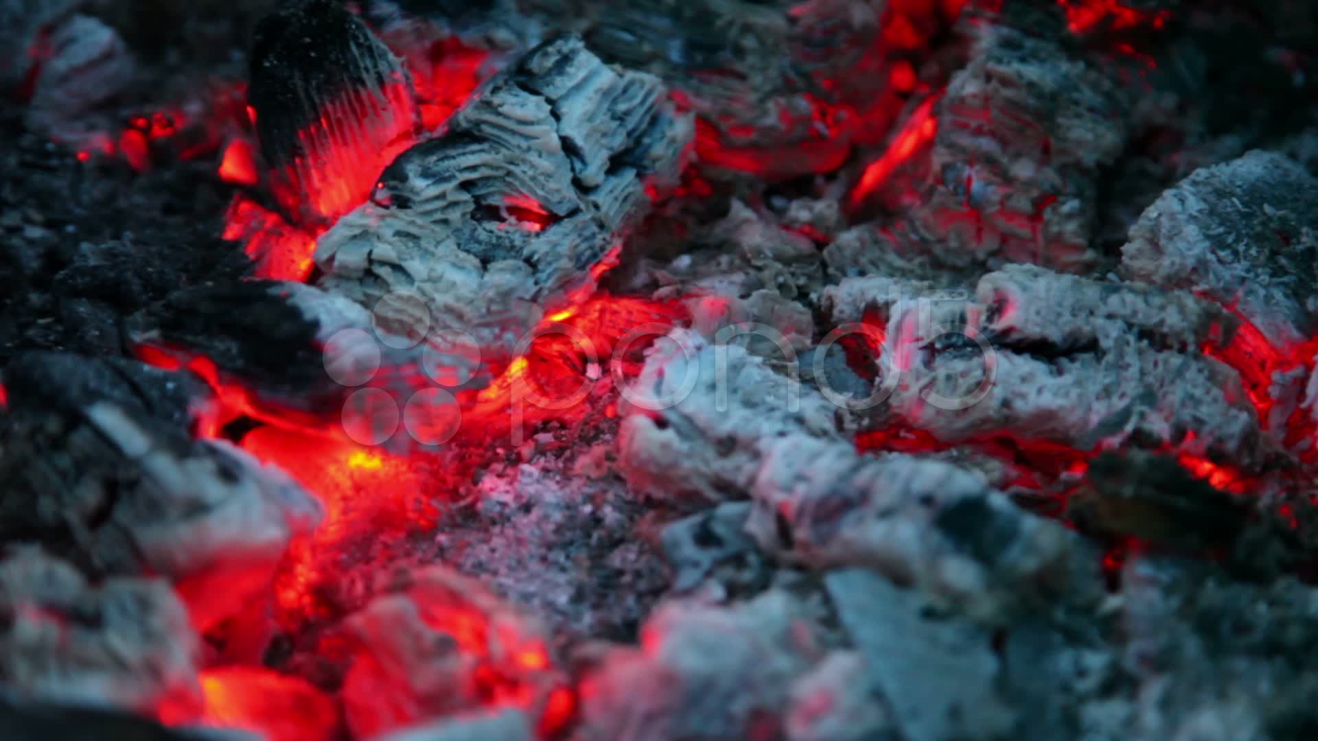 Flicker of smoldering embers lay in ashes, closeup view ~ Hi Res ...