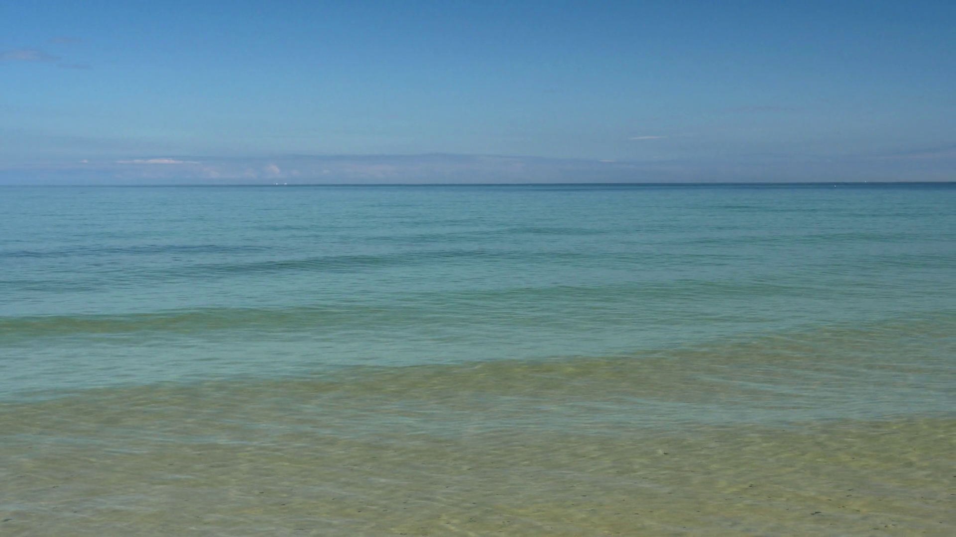 Beach scene. Peaceful and relaxing. Calm sea and blue sky. Clip ...