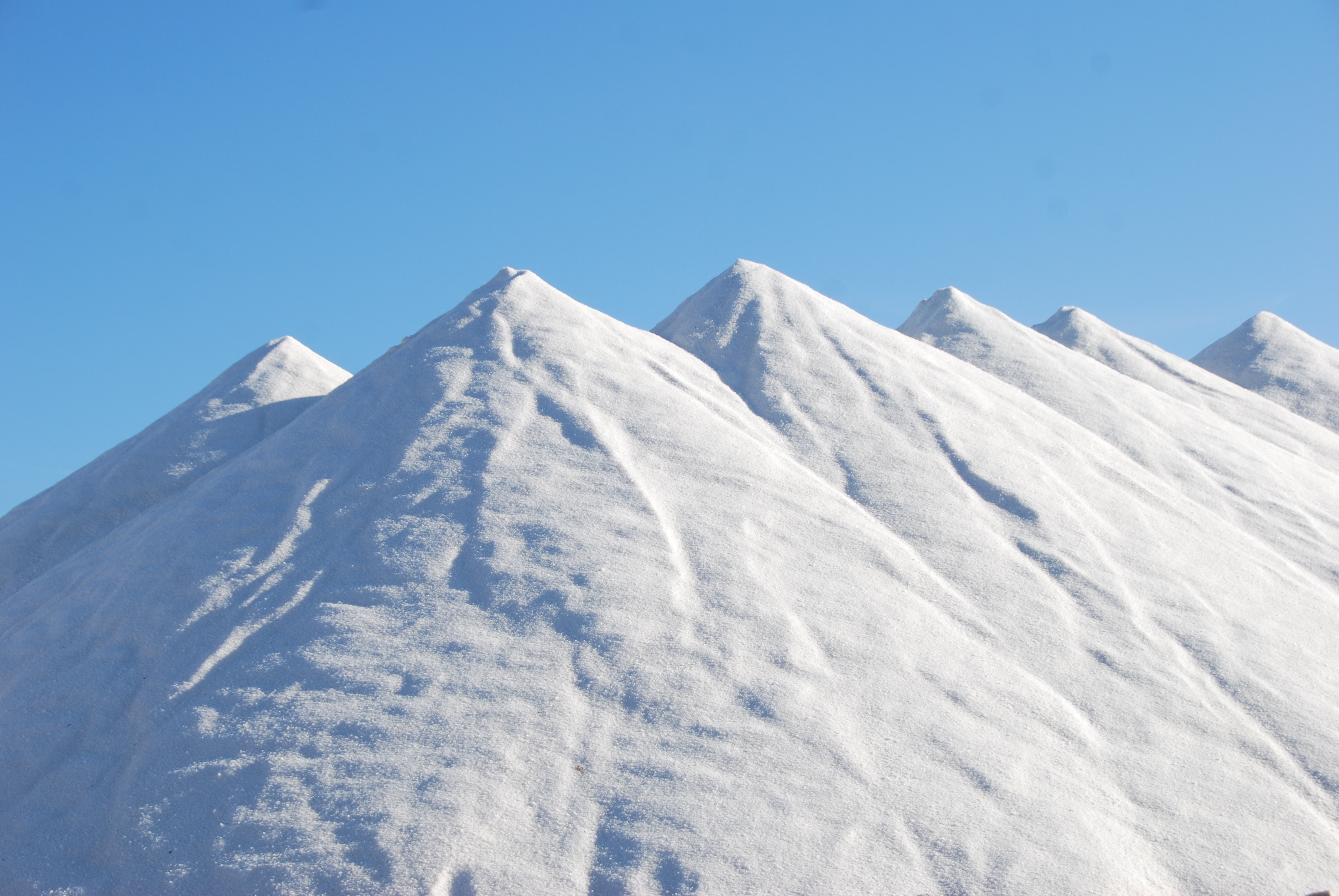 Snow covered mountain under blue sky at daytime photo