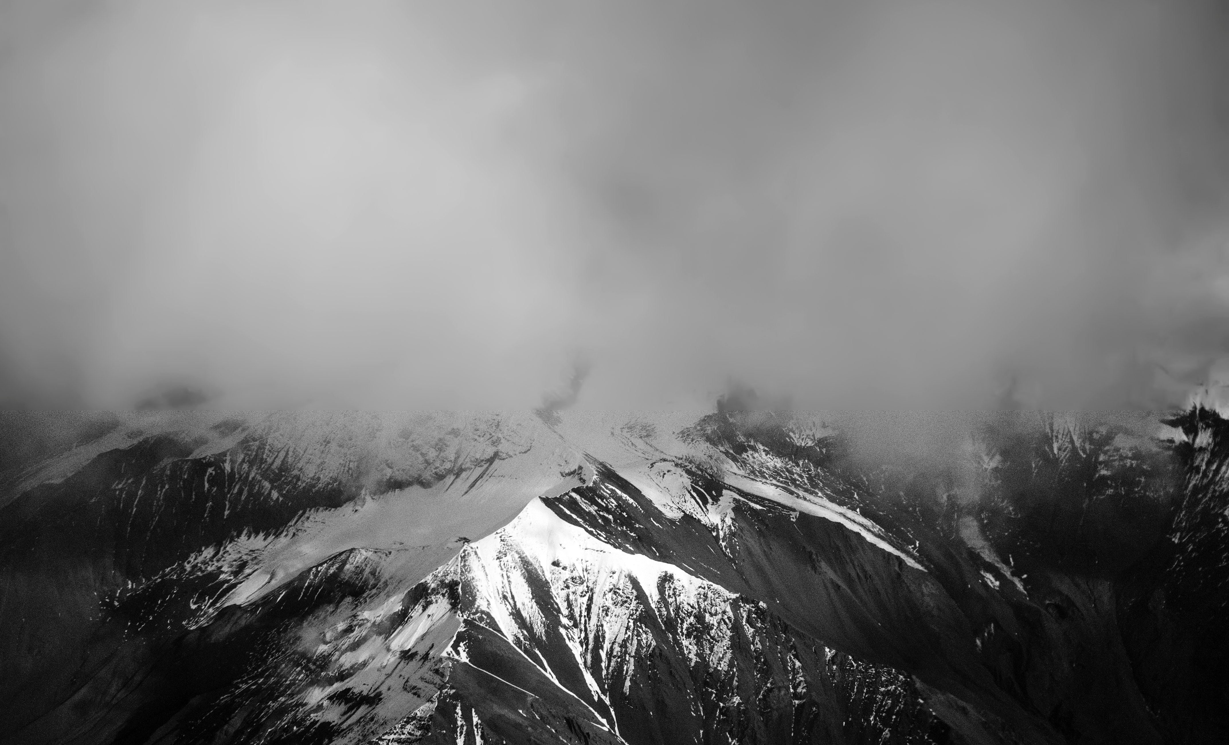 Snow covered mountain with mist photo