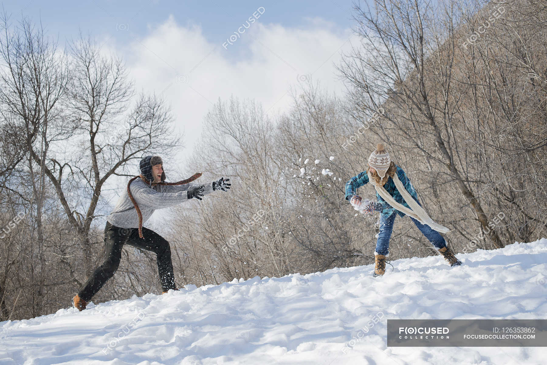 Couple having a snowball fight. — Stock Photo | #126353862