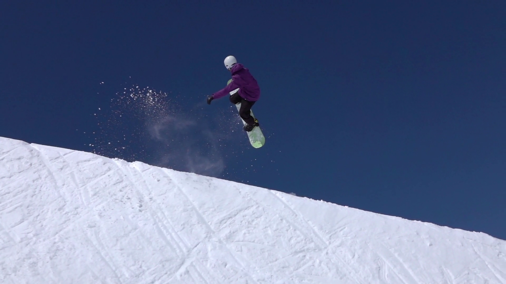 SLOW MOTION: Young pro snowboarder jumping in half pipe snow park ...