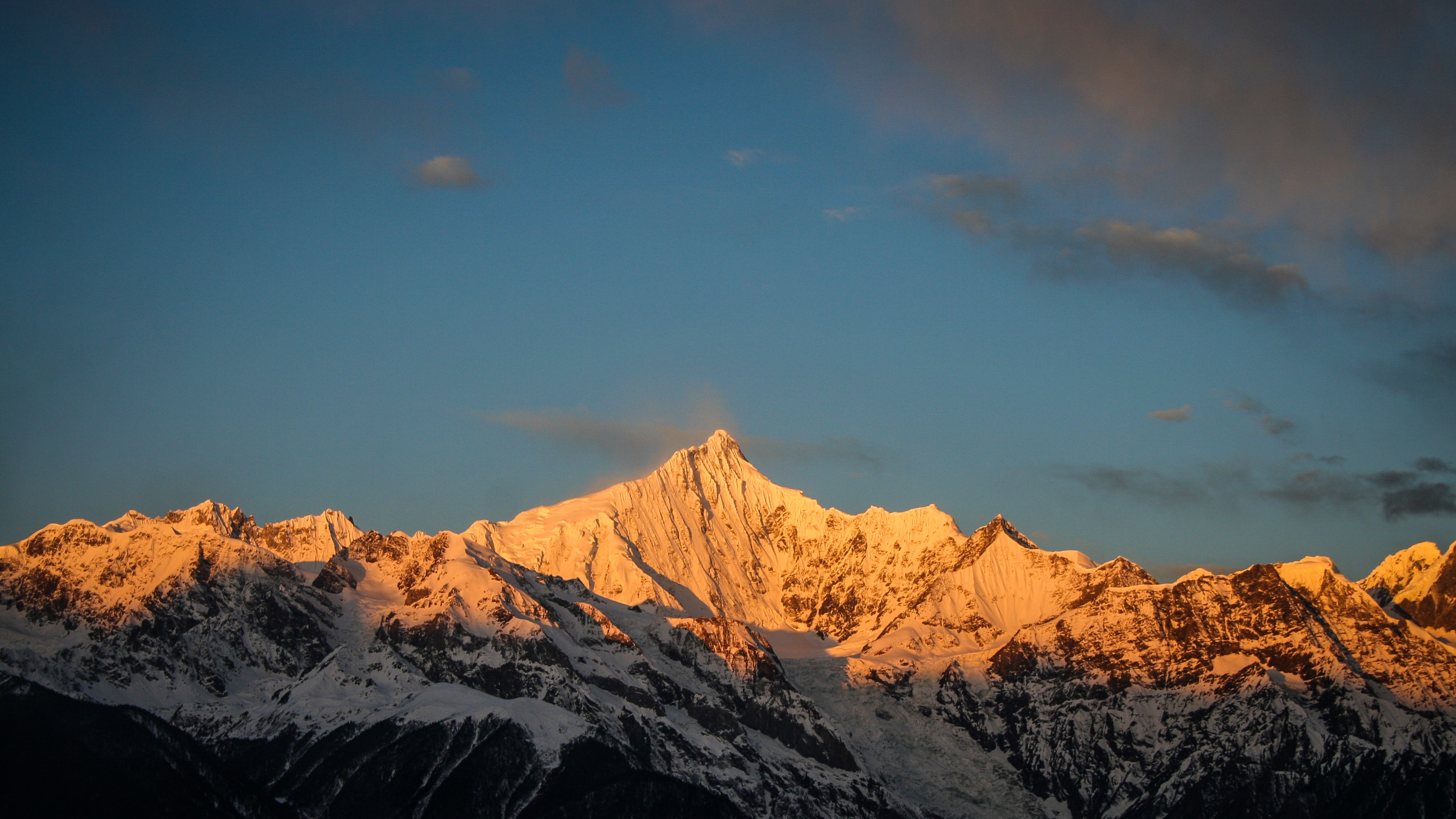 Snowy mountain during golden hour photo
