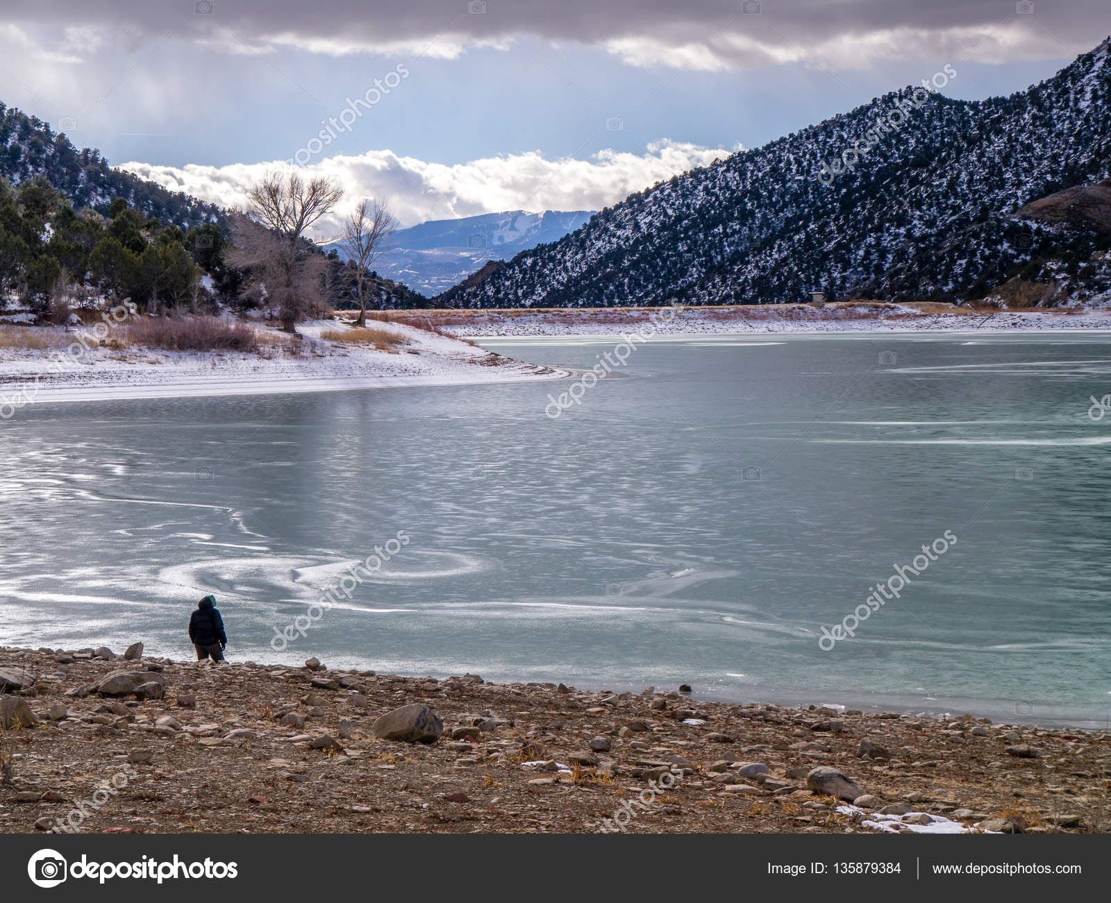 Solitary Figure on Shore of Frozen Lake — Stock Photo © DMHENRY ...