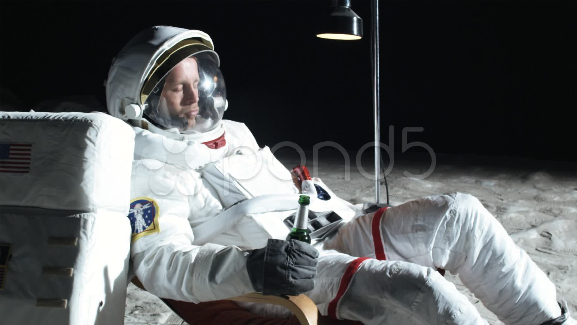Video: SLO MO, MS, Lockdown, astronaut on the moon sitting in a ...