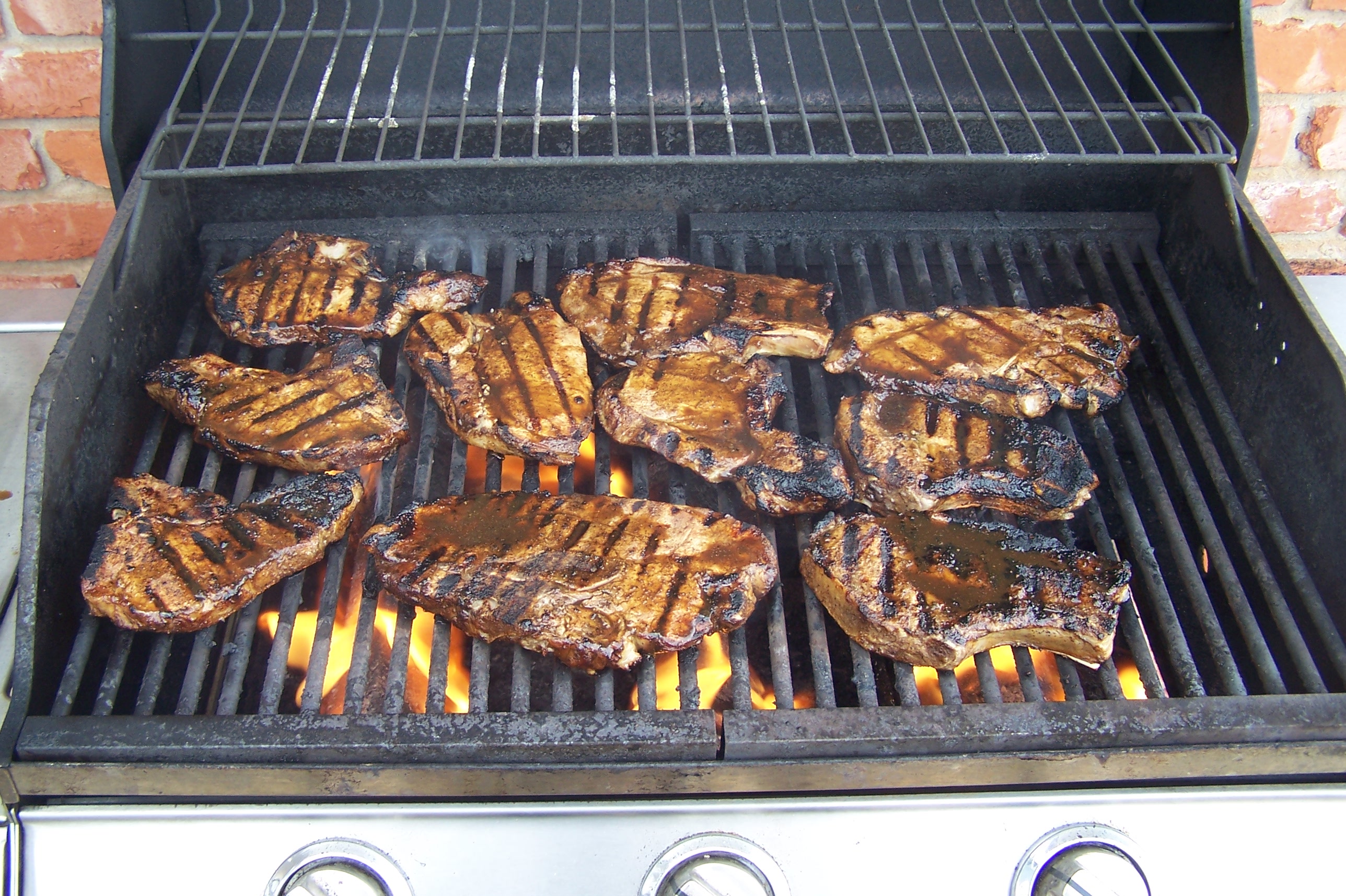 Spicy pork chops on grill 1 photo