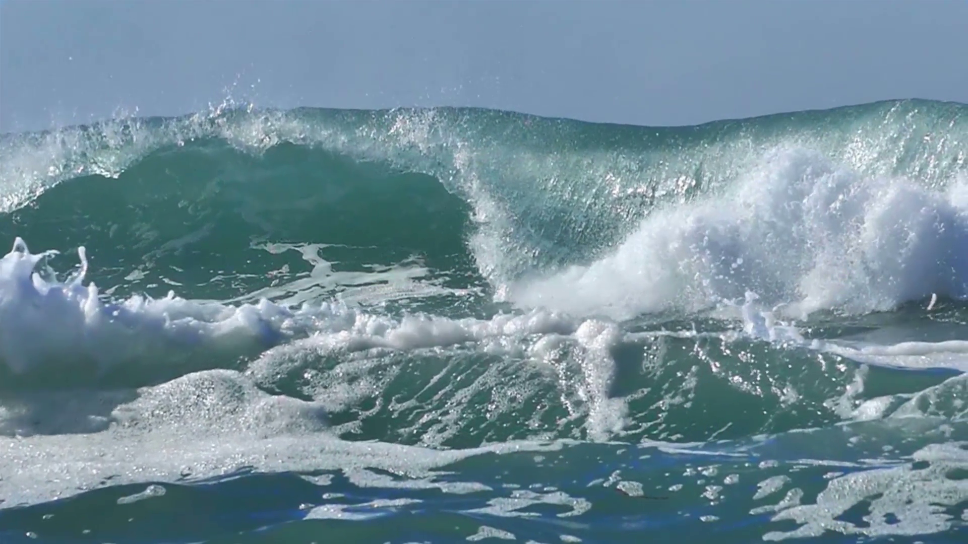 Ocean big wave splash foam green water blue sky Stock Video Footage ...