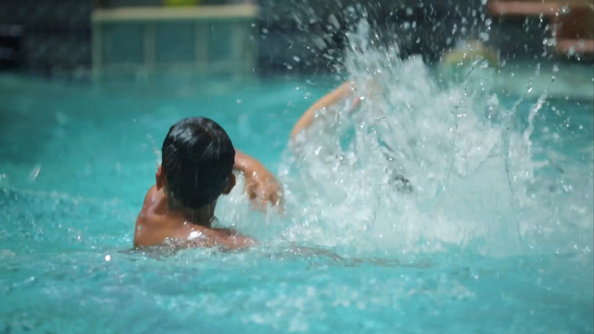 Kids splashing water in a pool Stock Video Footage - Videoblocks