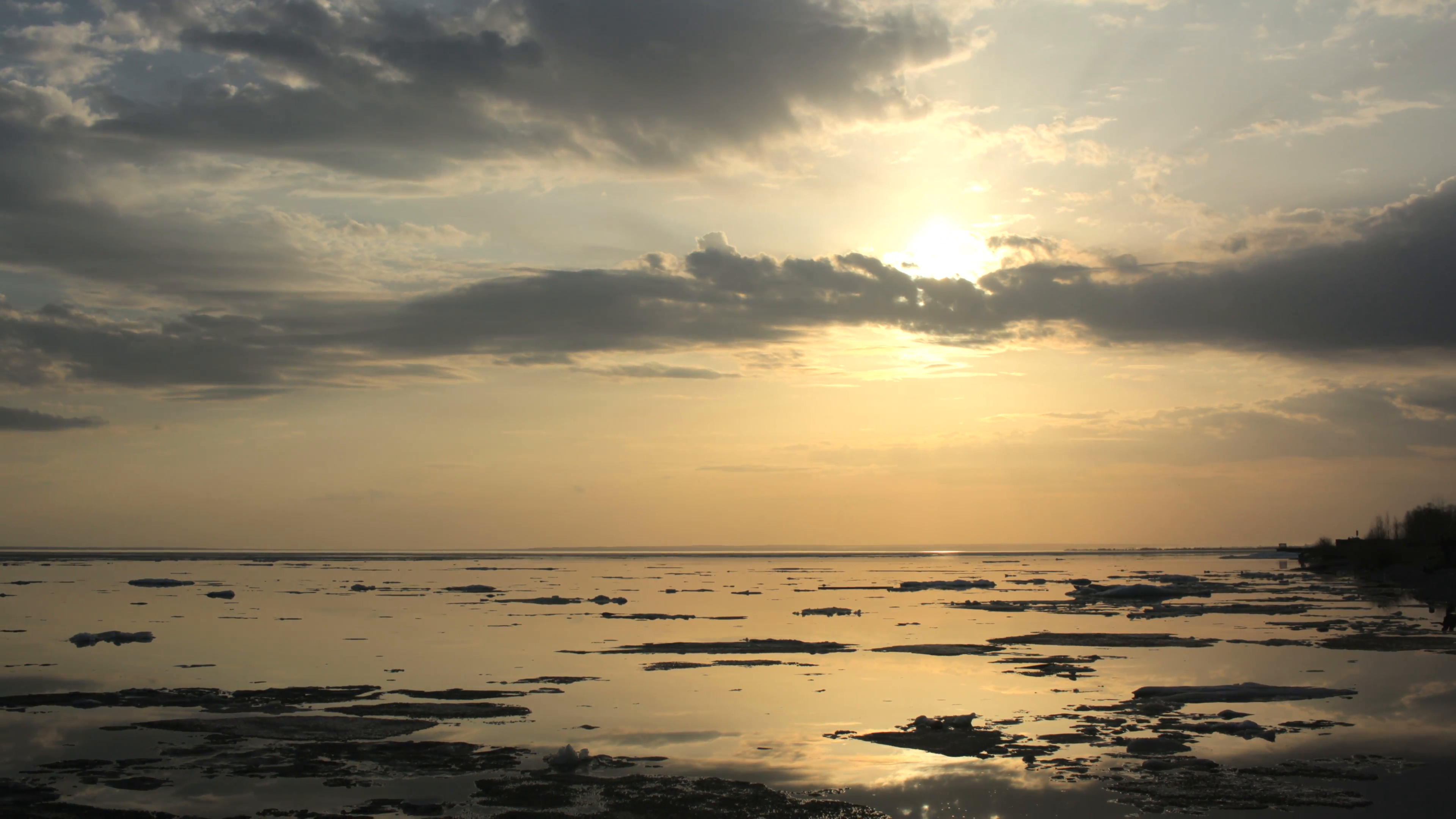 4k Time-lapse Sunset. Ice drift on the river. In the spring the ice ...
