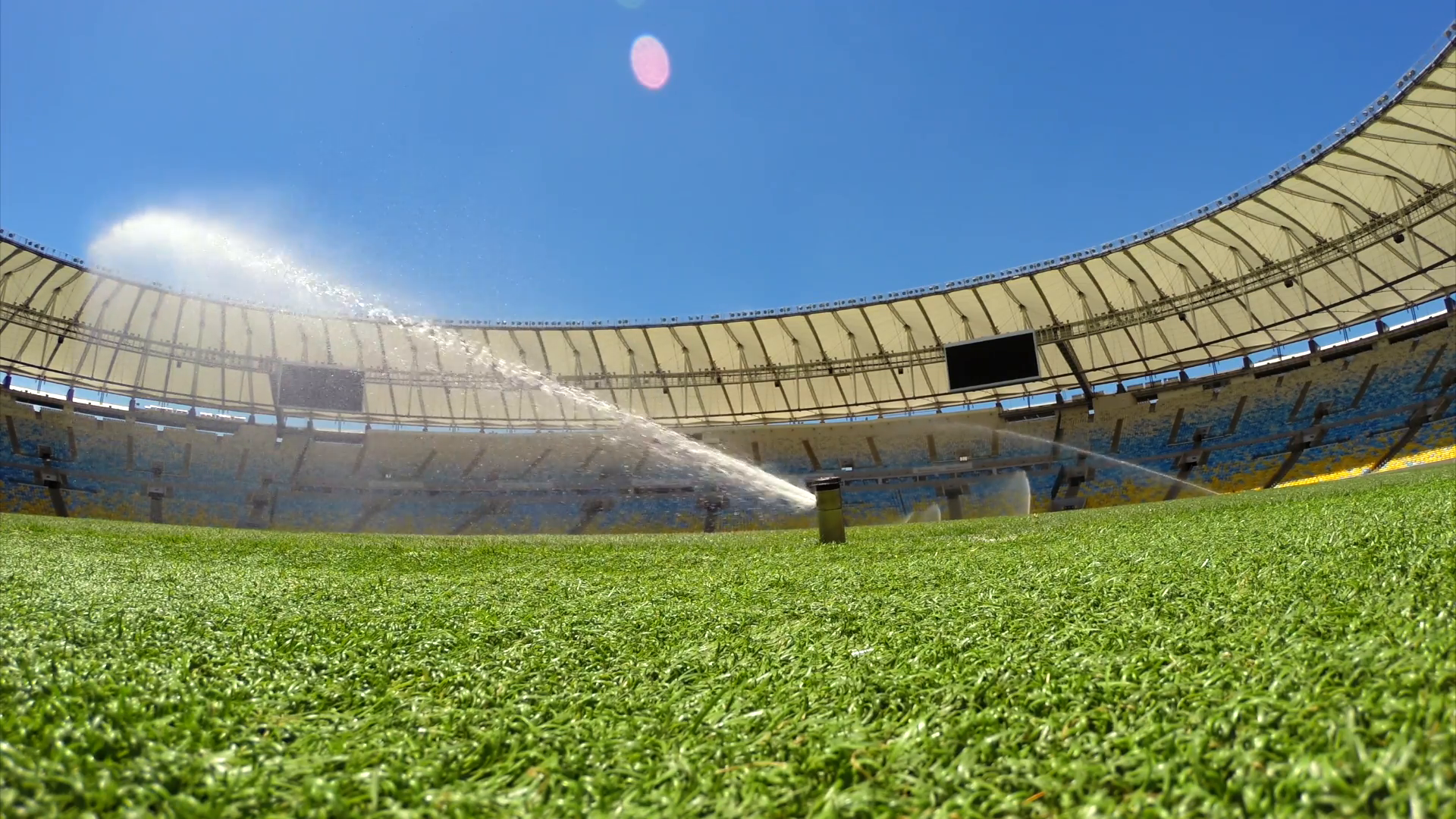 RIO DE JANEIRO - FEBRUARY 7, 2014: Field-level view of sprinklers ...