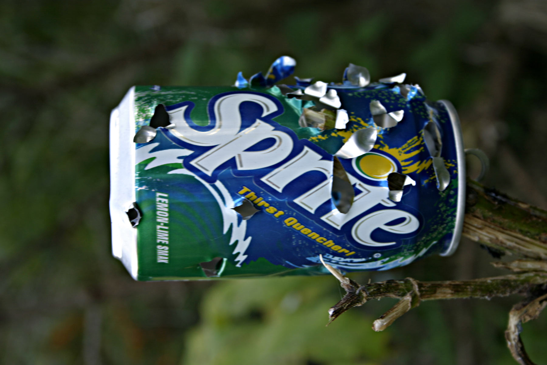 Sprite can with bullet holes photo