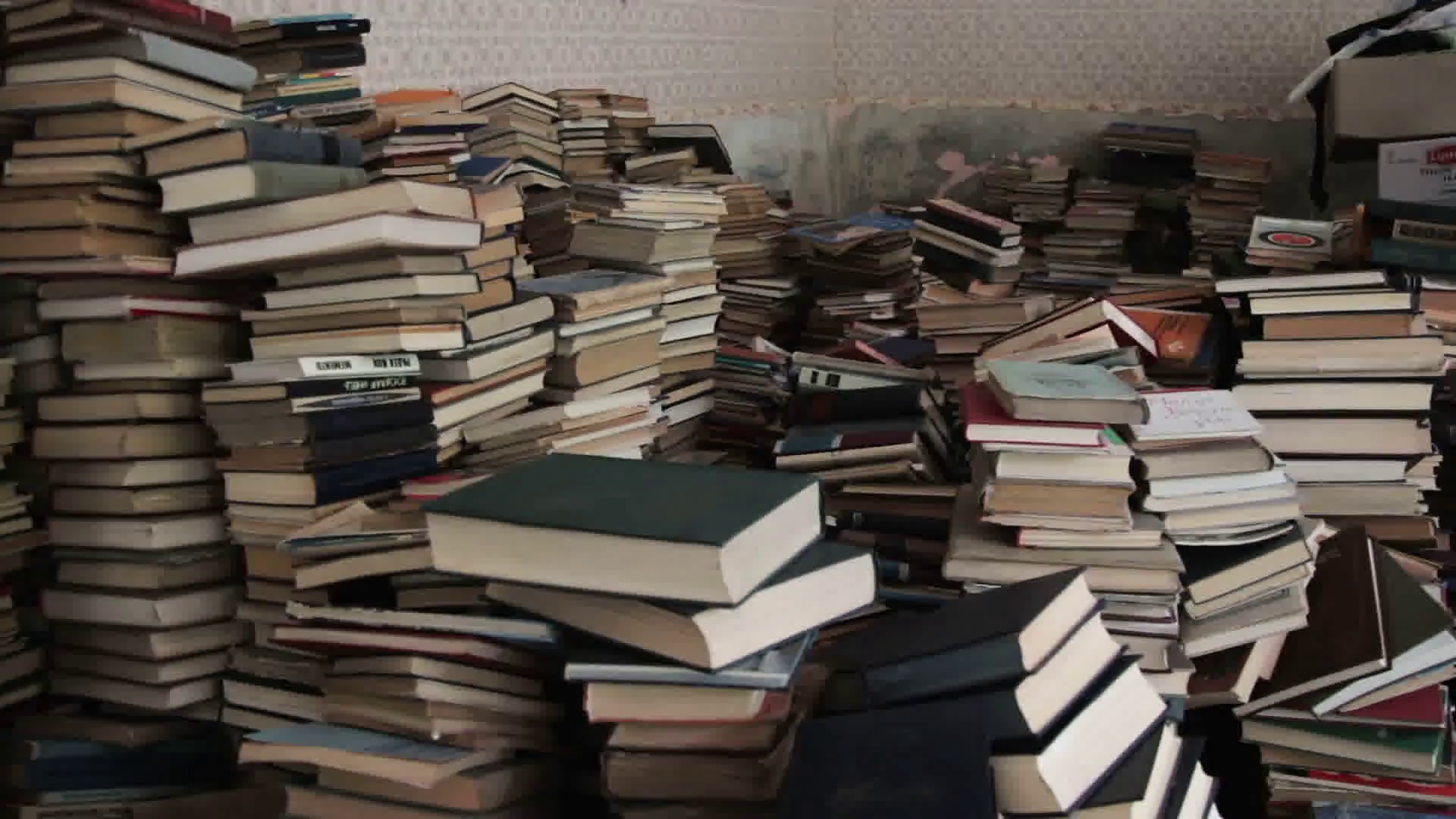 Stack of Books Scattered on the Floor in the Library Stock Video ...