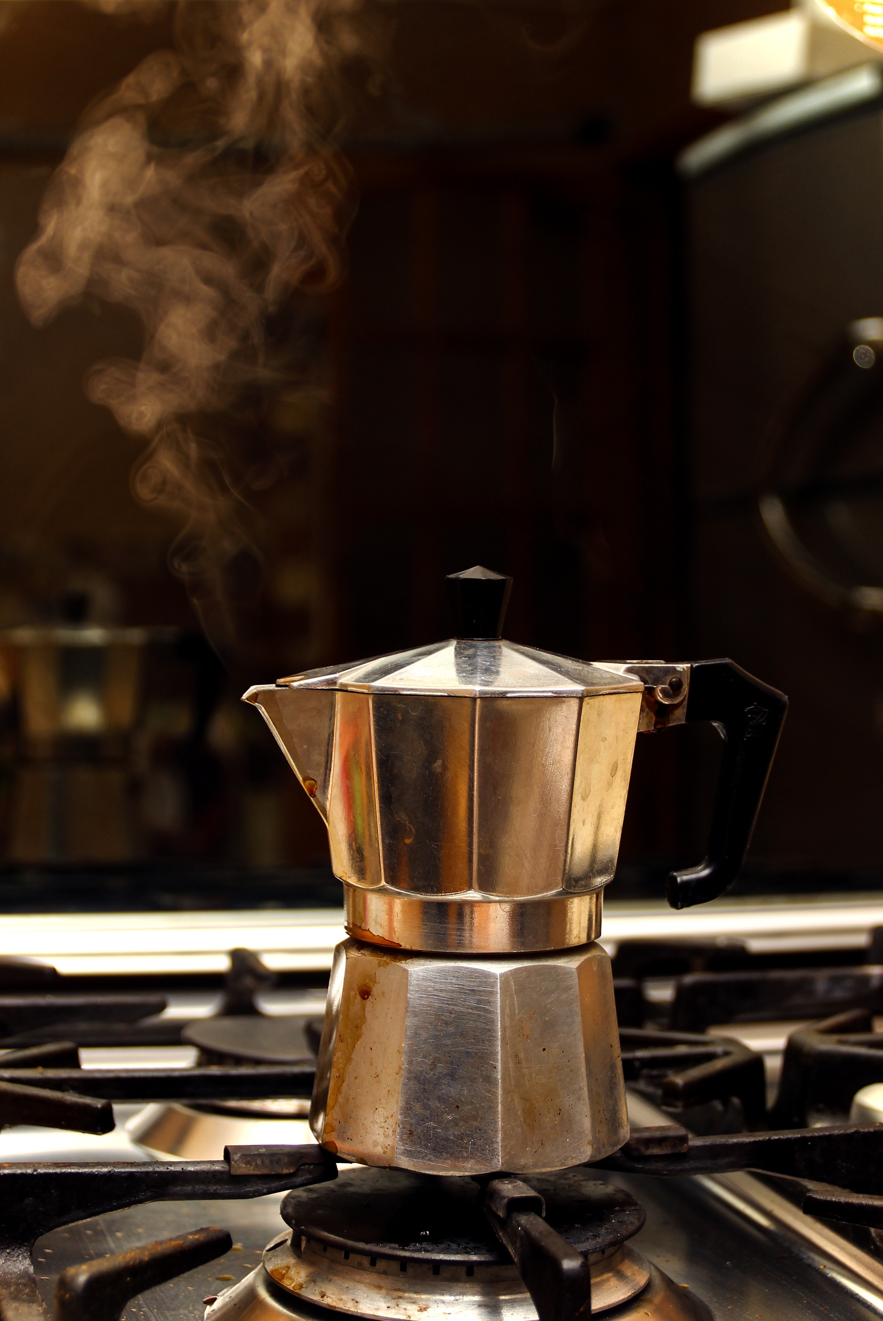 Stainless steel coffee maker on stove photo