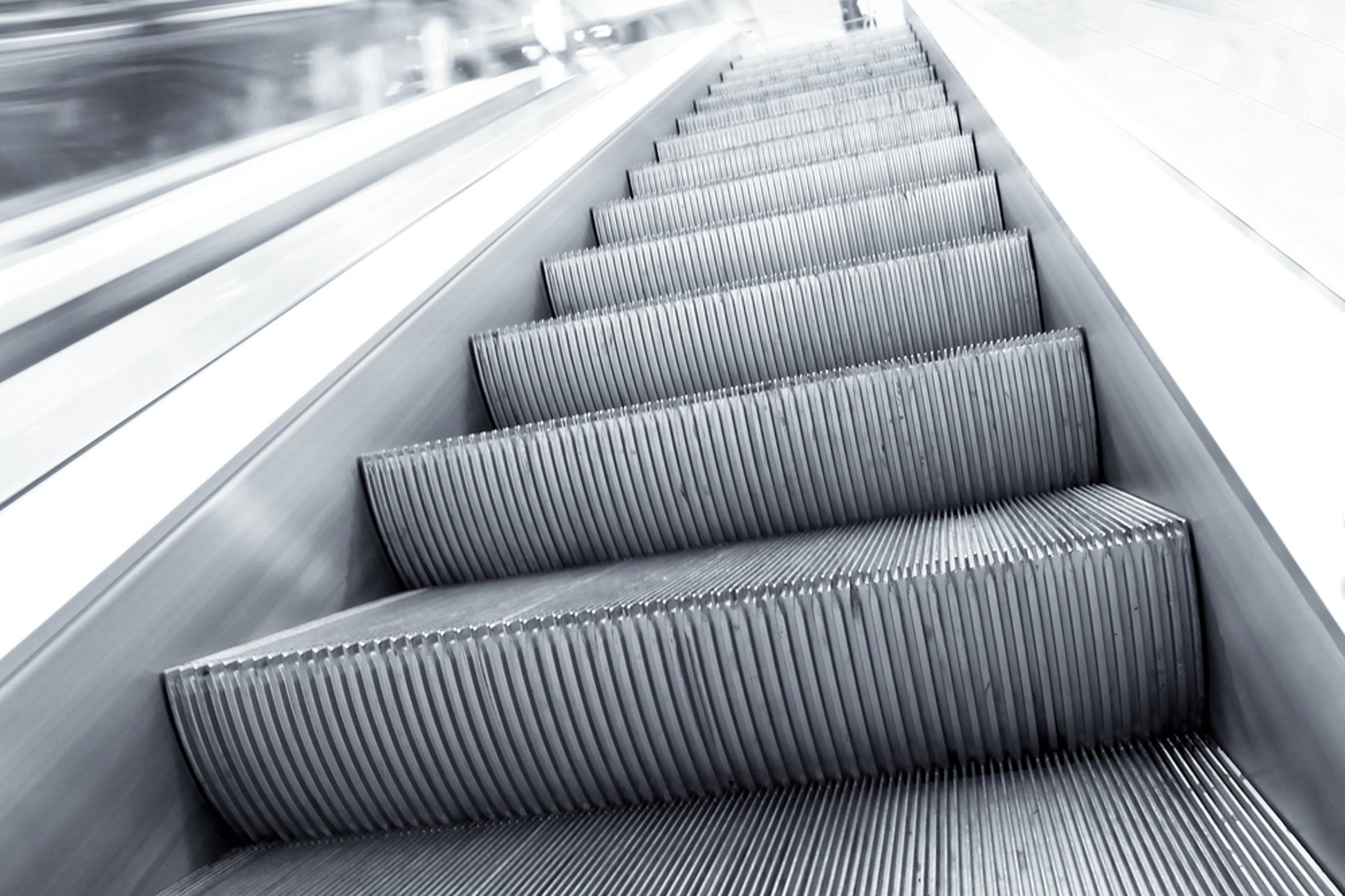 The Real Reason Why Escalator Stairs Have Grooves | Reader's Digest