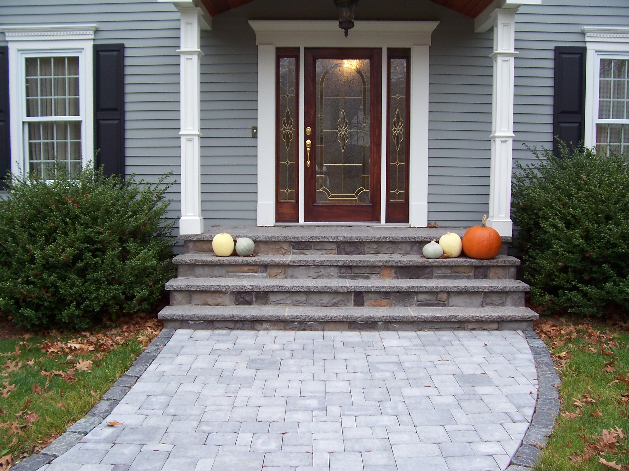 Reclaimed granite pavers and cobblestone edging were used in this ...