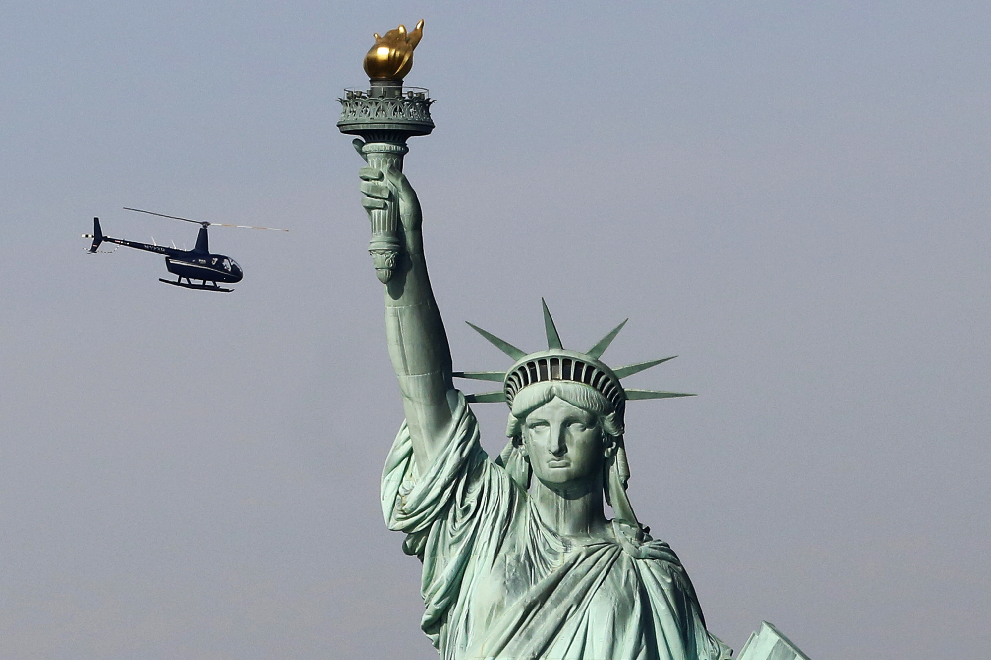 N.Y. governor vows to tap state funds to reopen Statue of Liberty as ...