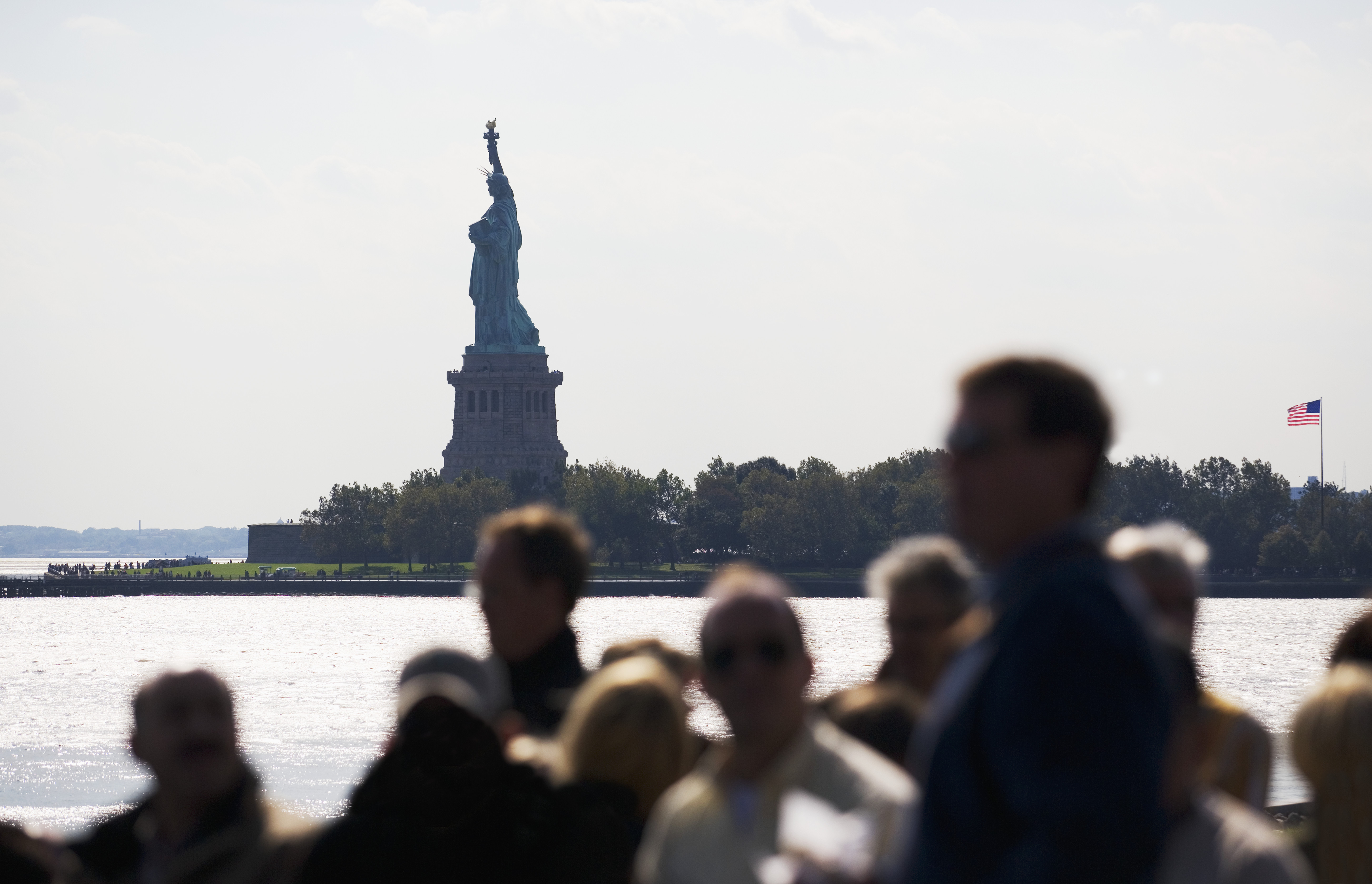 people-on-boat-near-statue-of-liberty - Immigration: Ellis Island ...