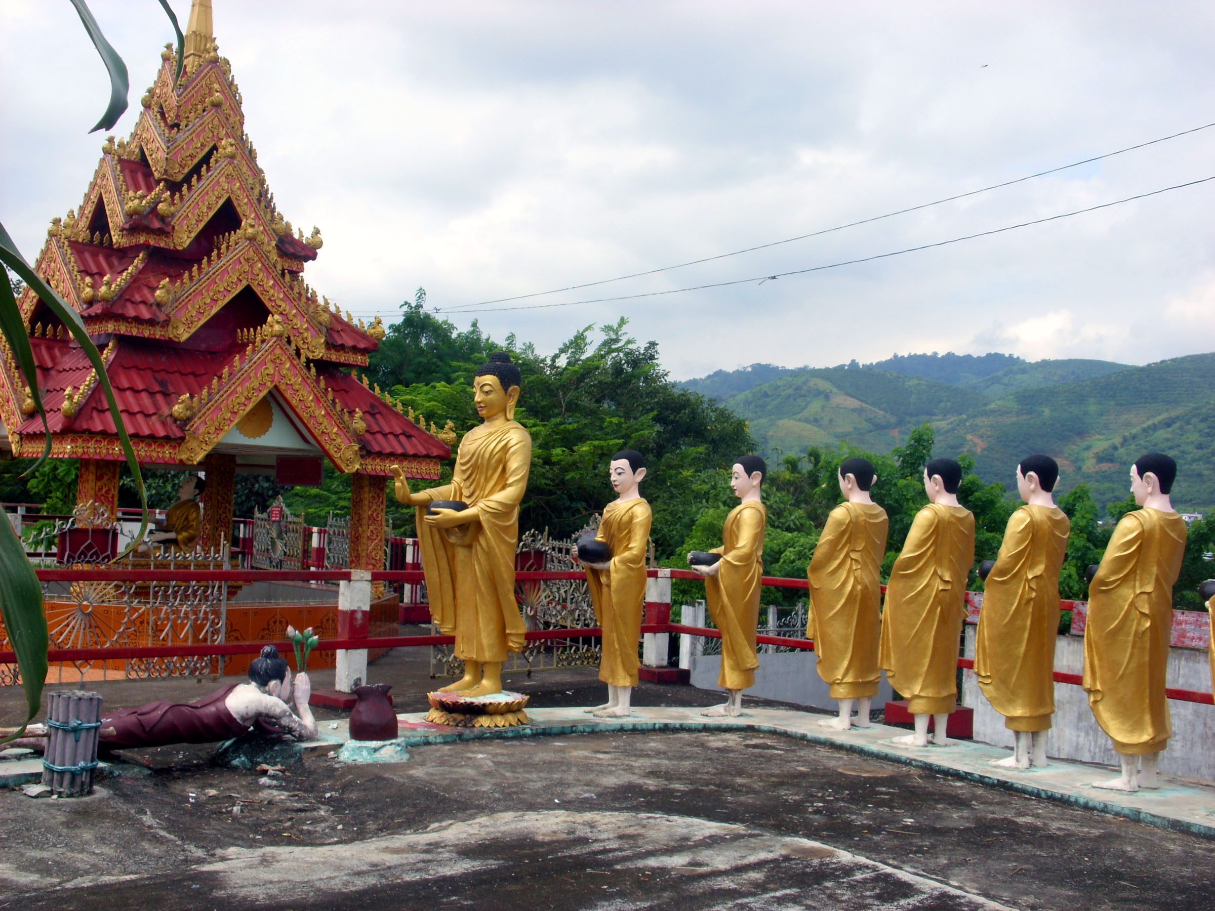 Statues of buddha and followers photo
