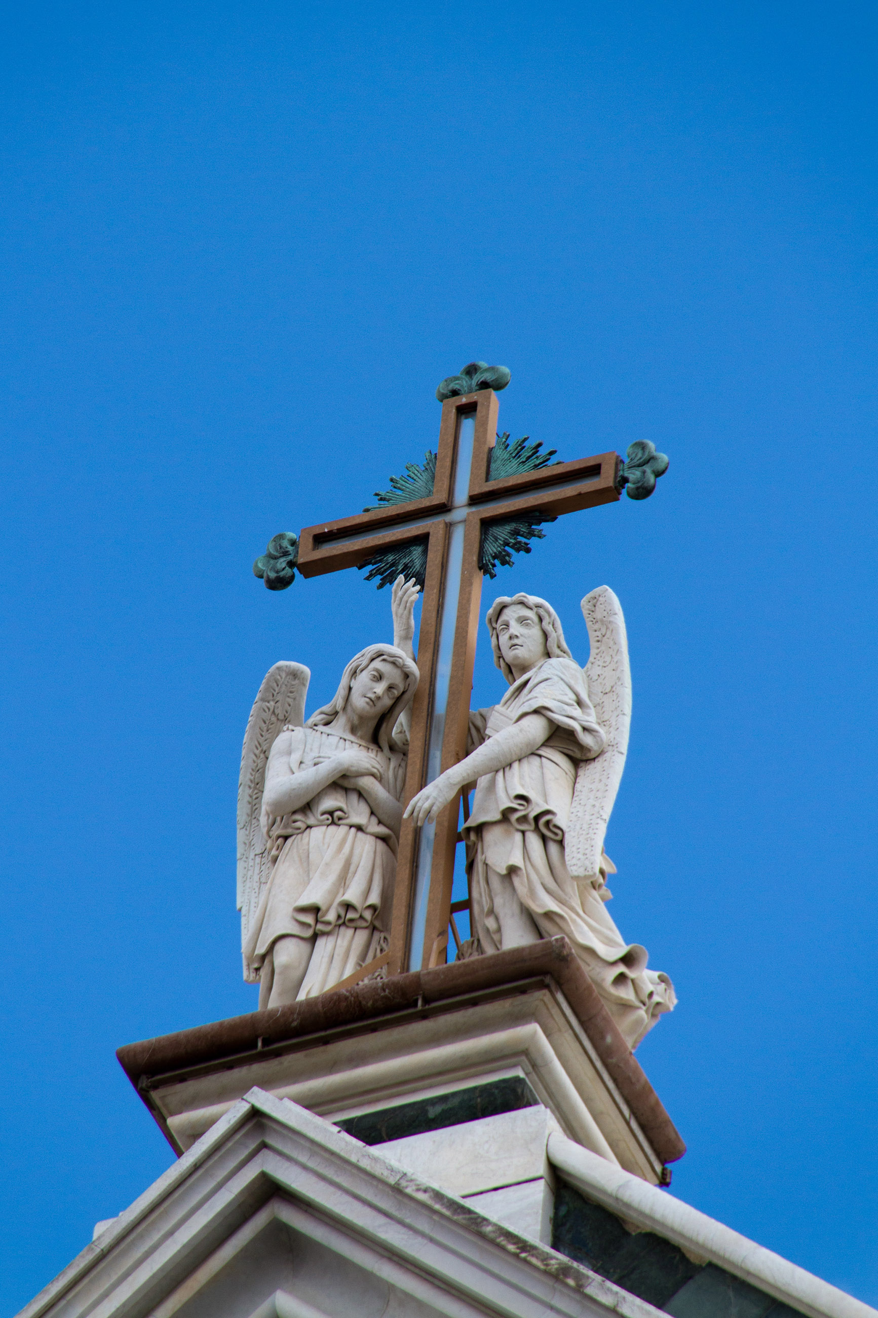 Statues on top of church photo