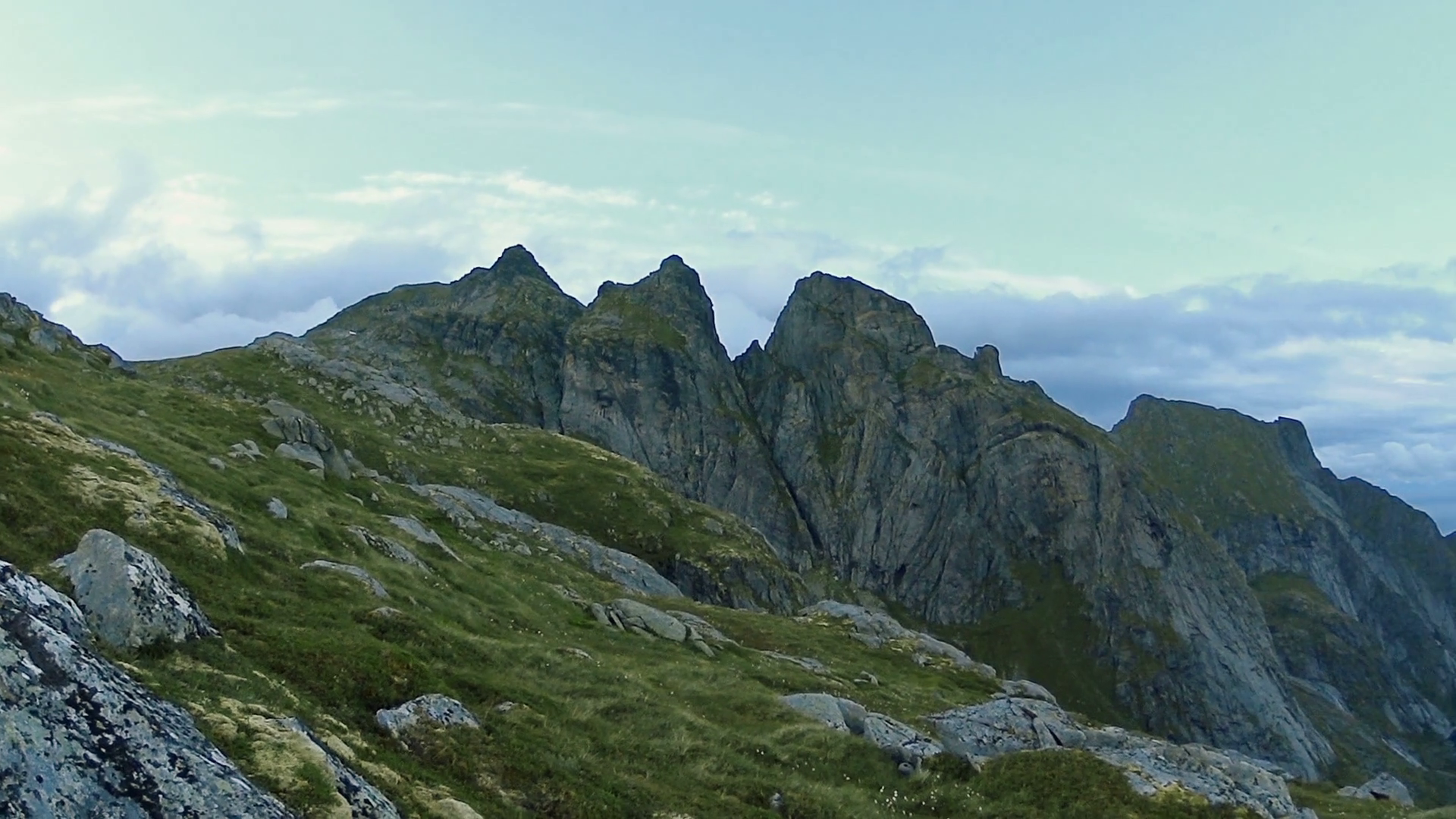 Lofoten islands,Norway. Hiking trip in mountains, steep cliff, peaks ...