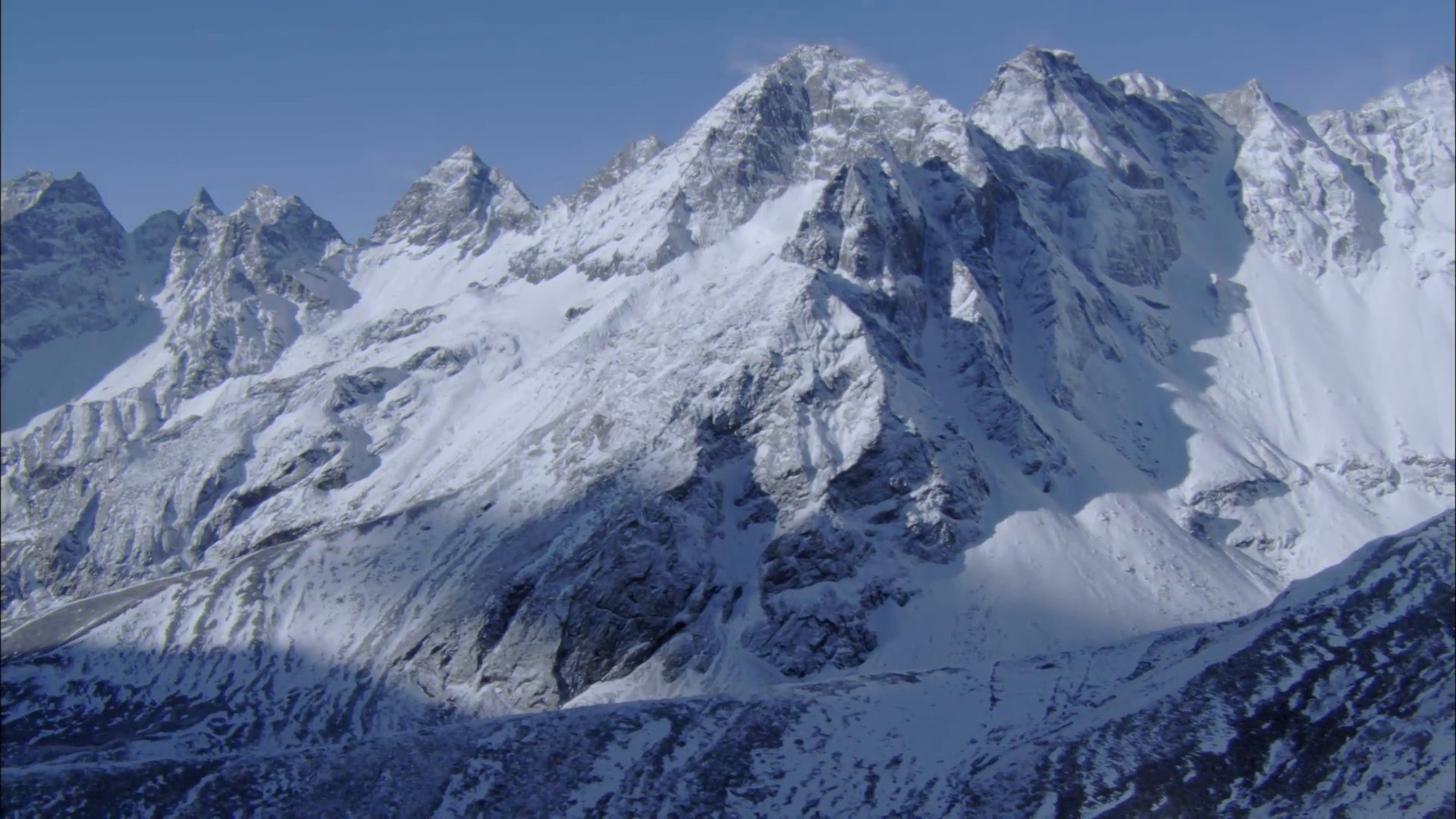 White Snow Himalaya Mountains. White snow covers a long, steep ...