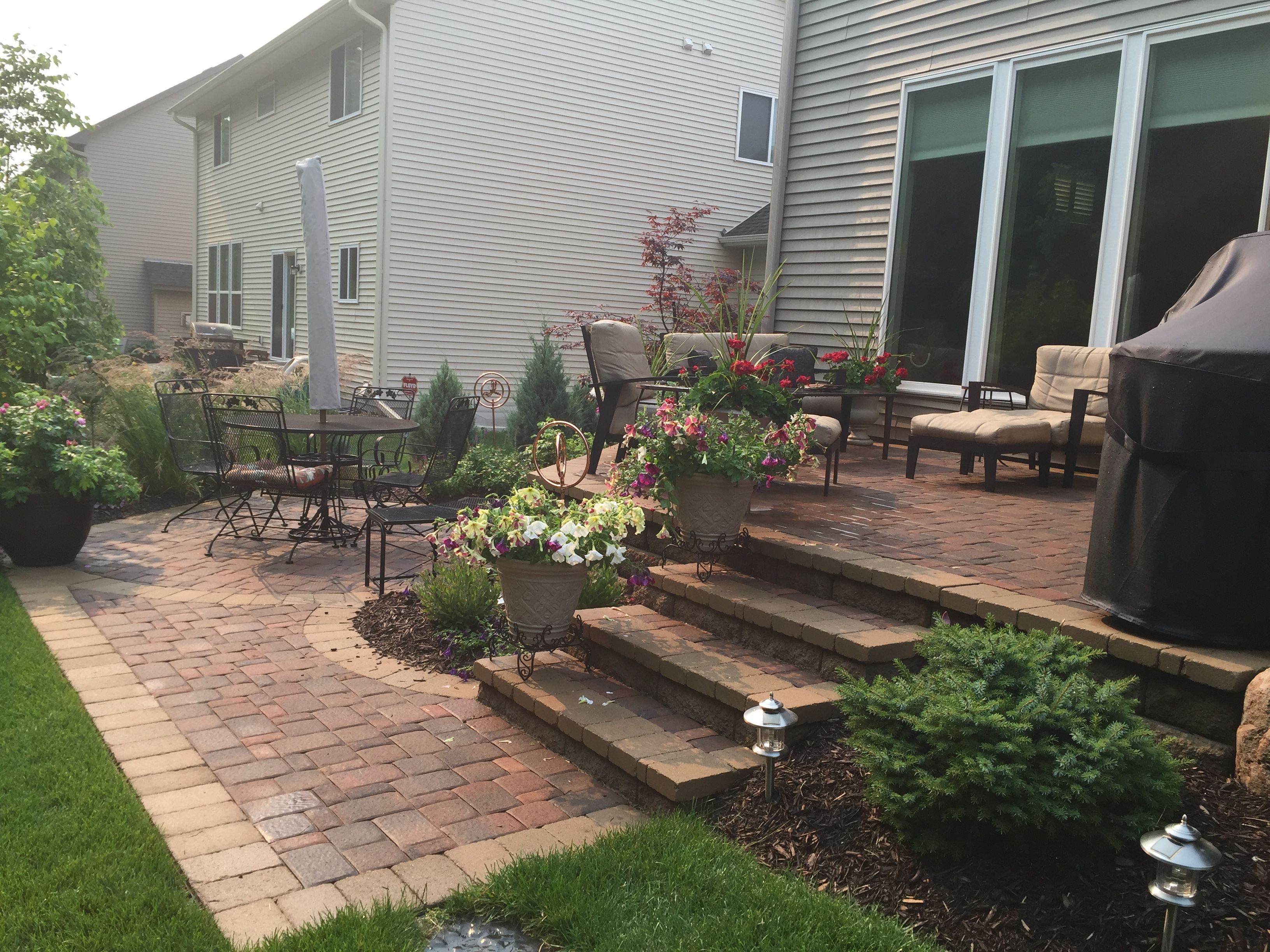 Raised patio with steps down to a second patio space. Two Level ...