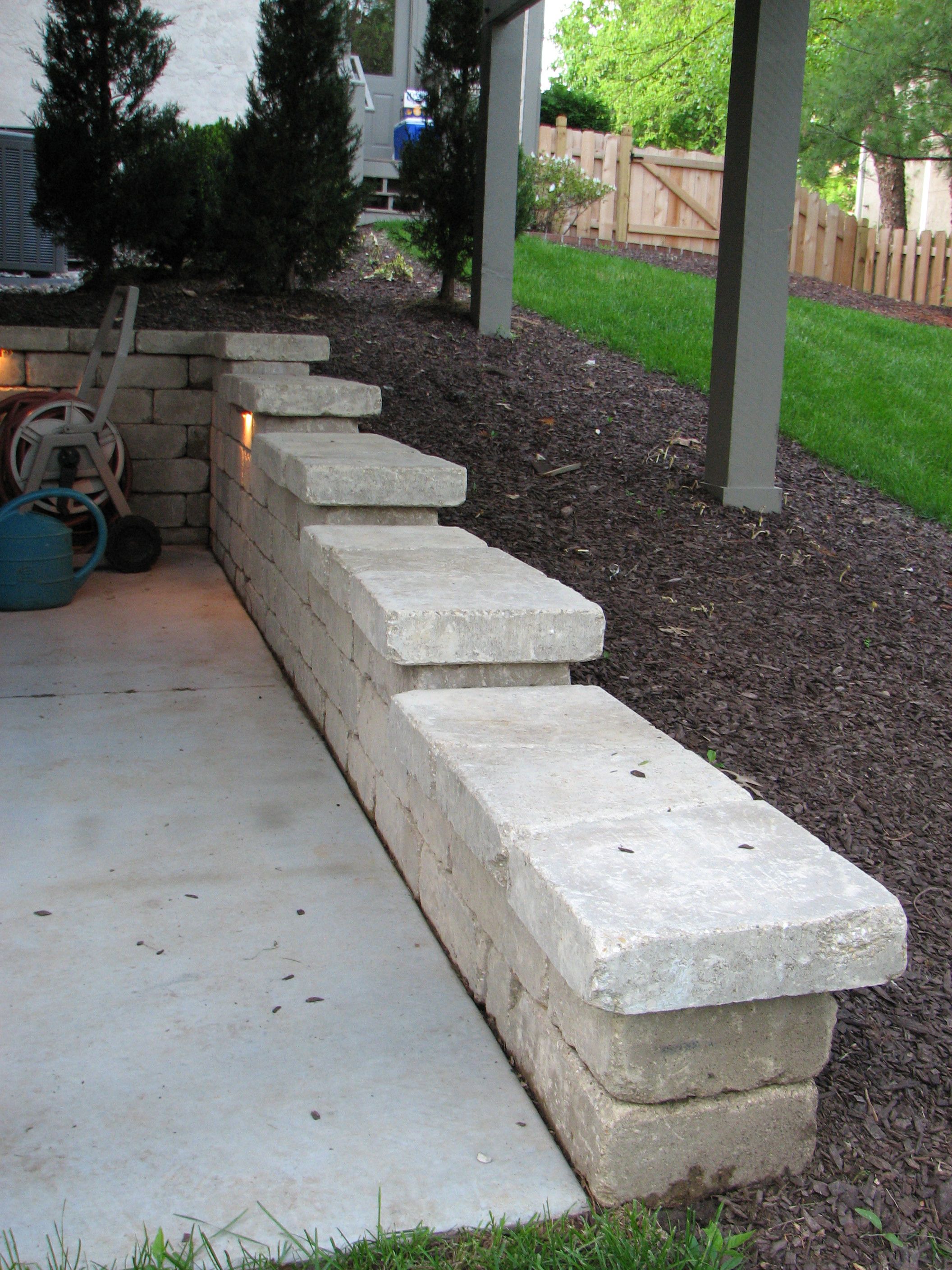 This retaining wall steps down a slope and keeps debris from washing ...