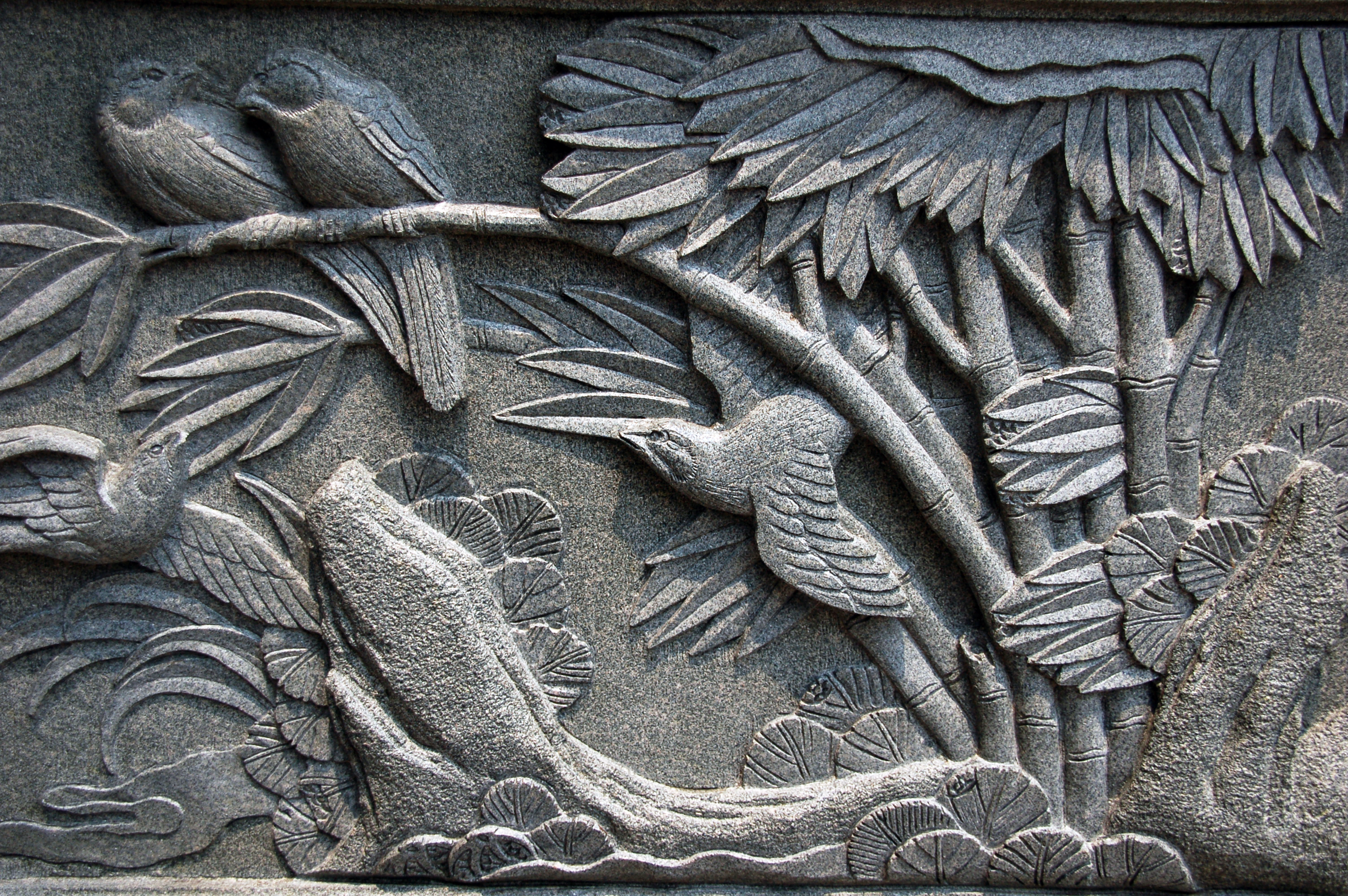 File:Birds on branches stone wall art.jpg - Wikimedia Commons