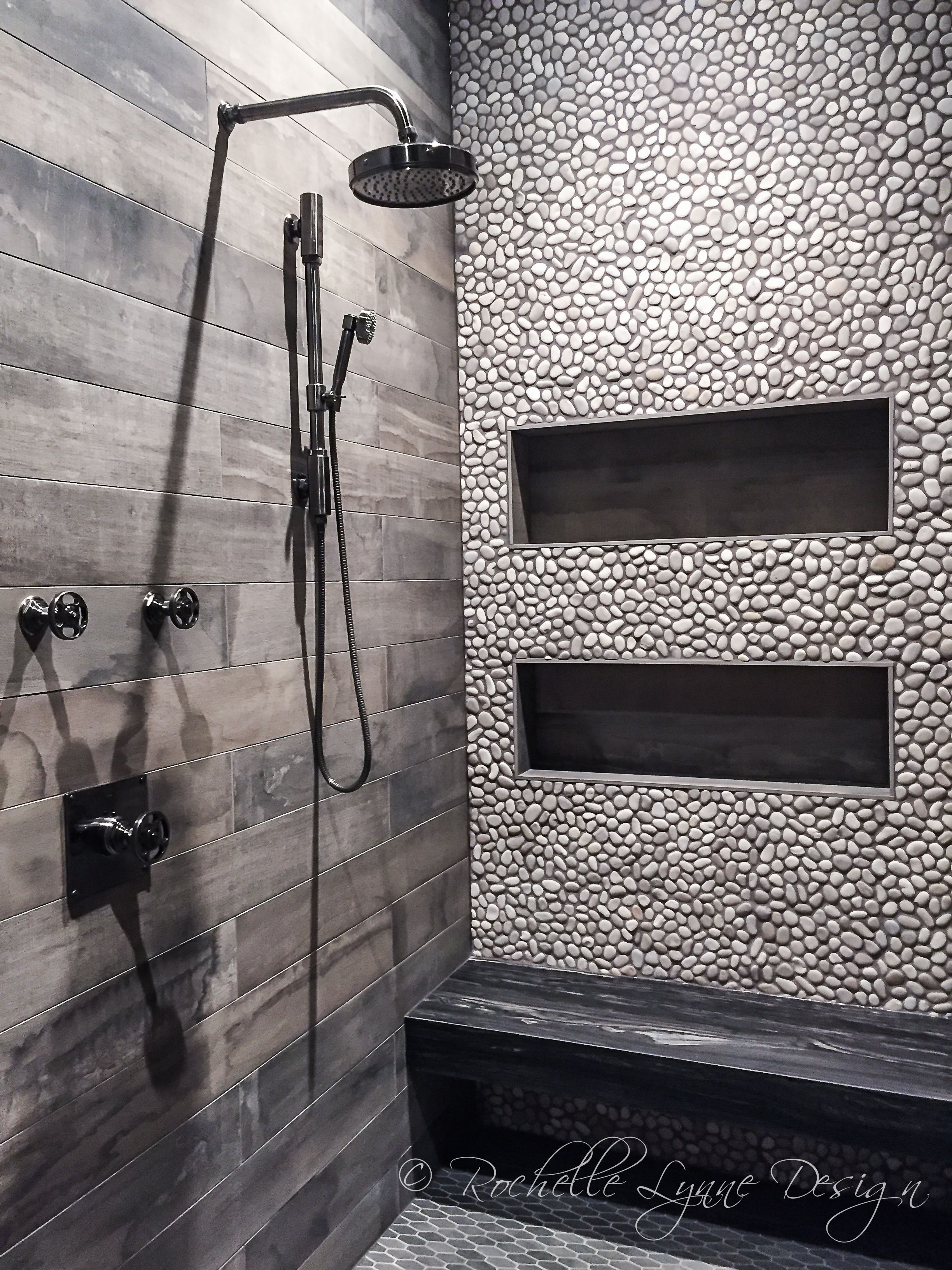 Wood look tile and pebbles in shower, bench seat of stone, large ...