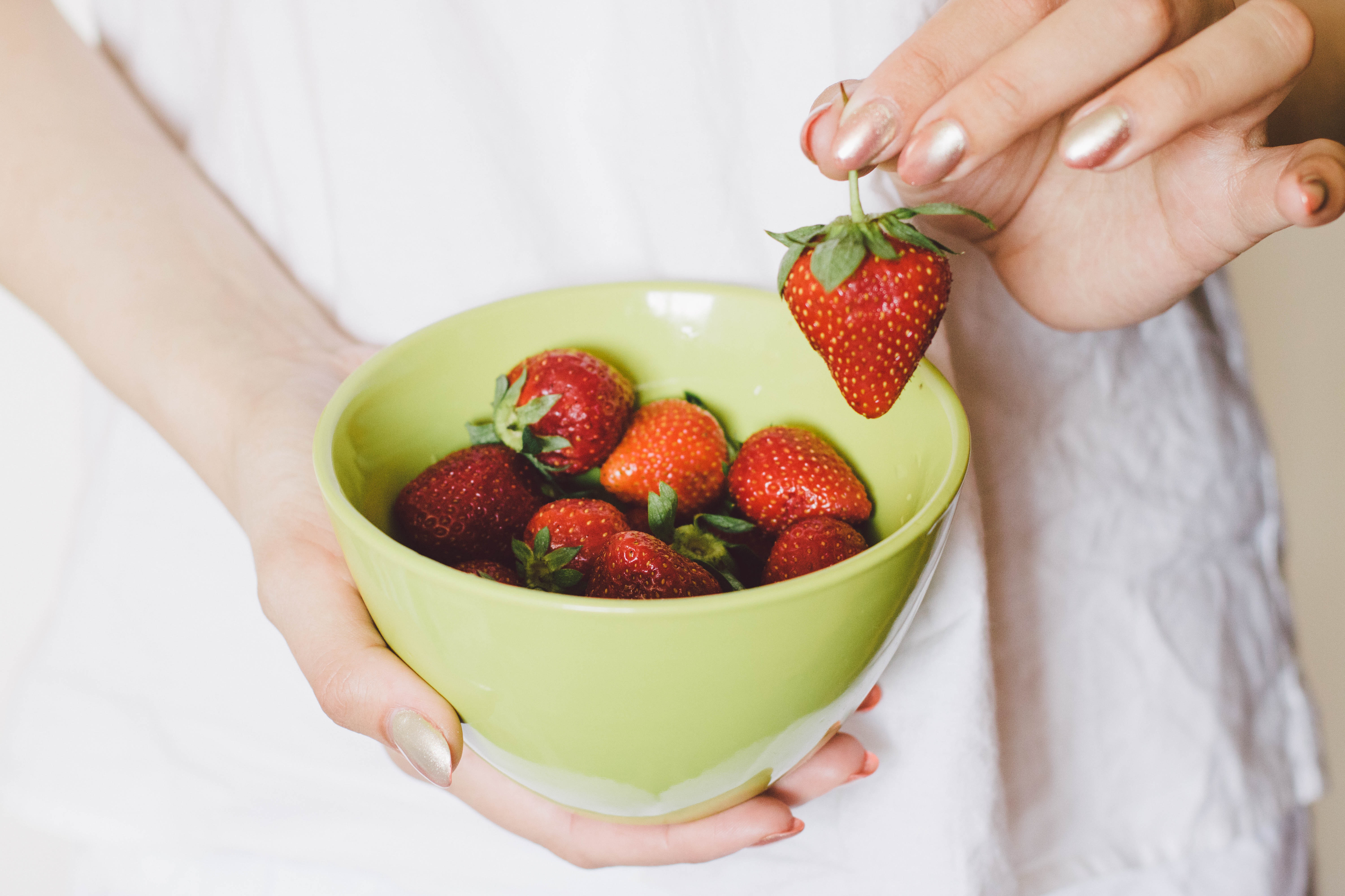 Strawberries on green bowl photo