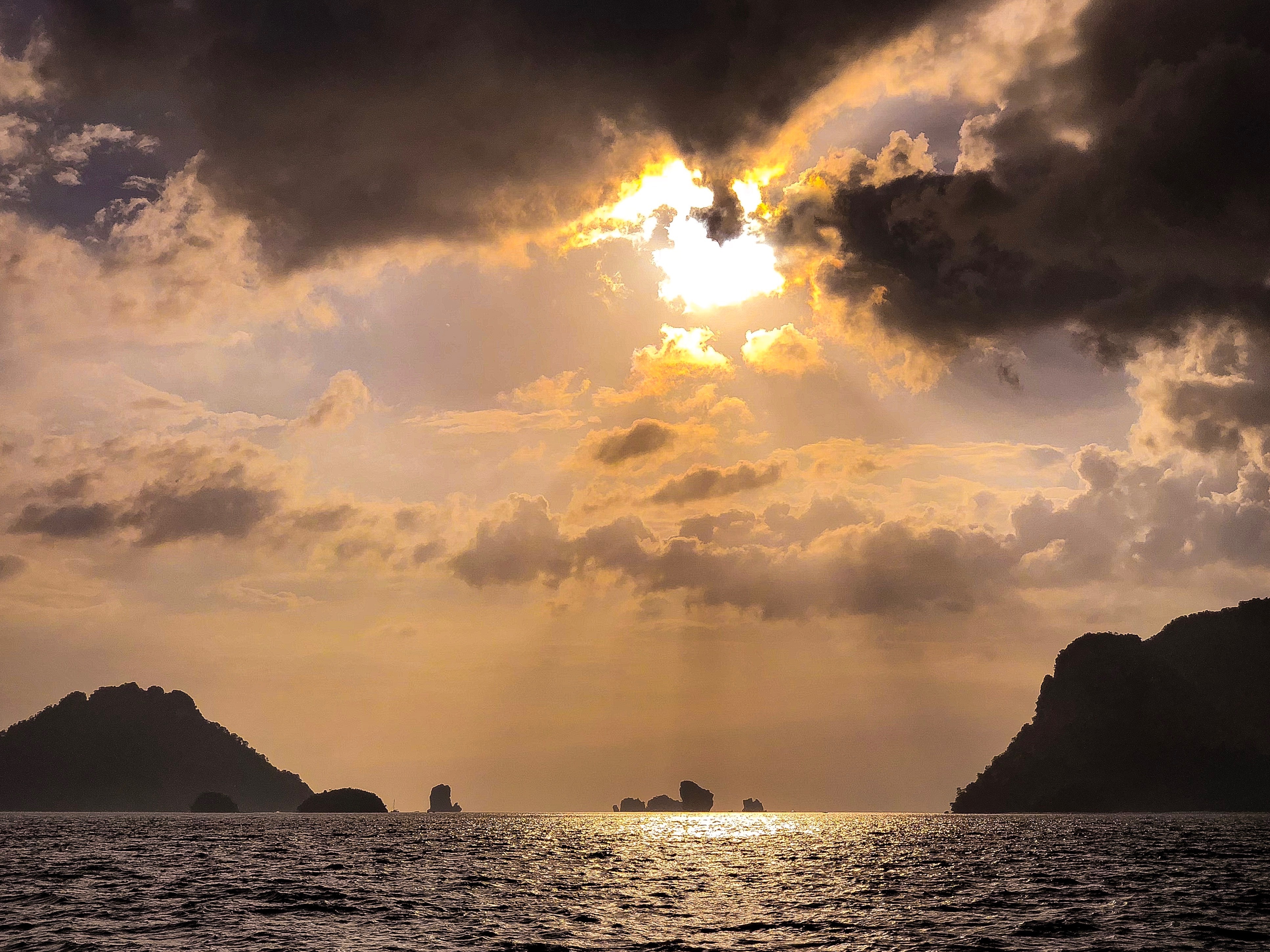 Sun rays over sea with islands photo