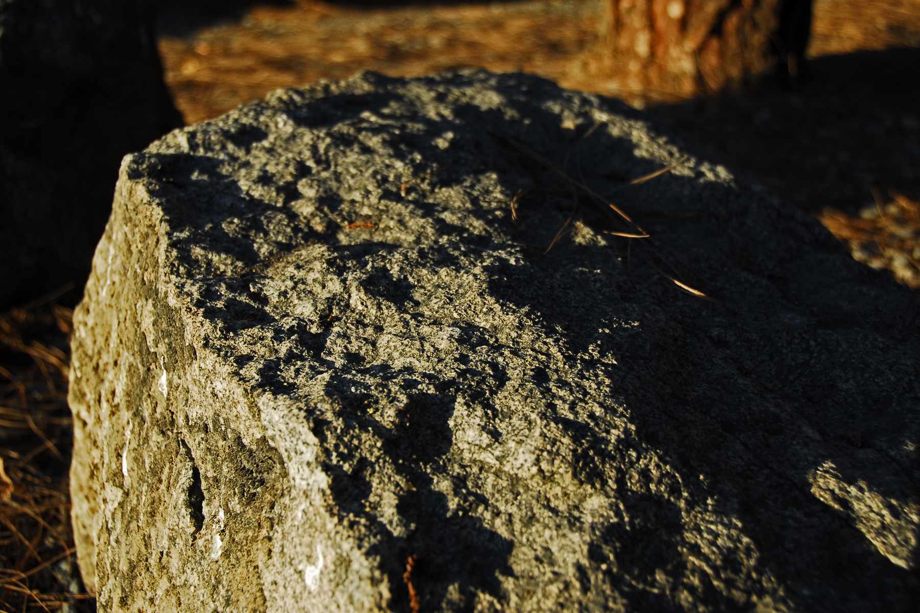 Sundown encompassing a boulder photo