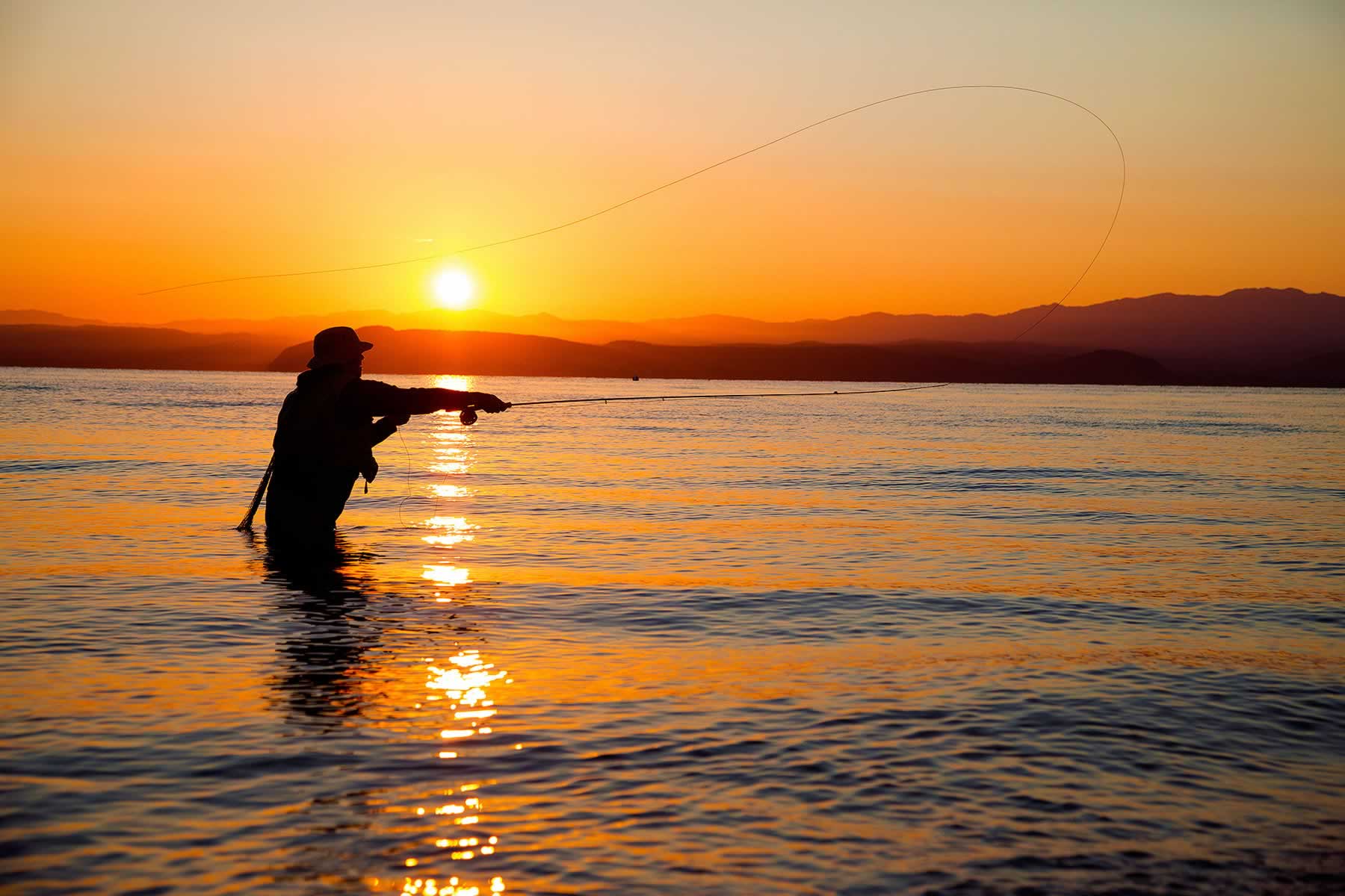 Fly-fishing-Lake-Taupo-sunset | Open Parachute