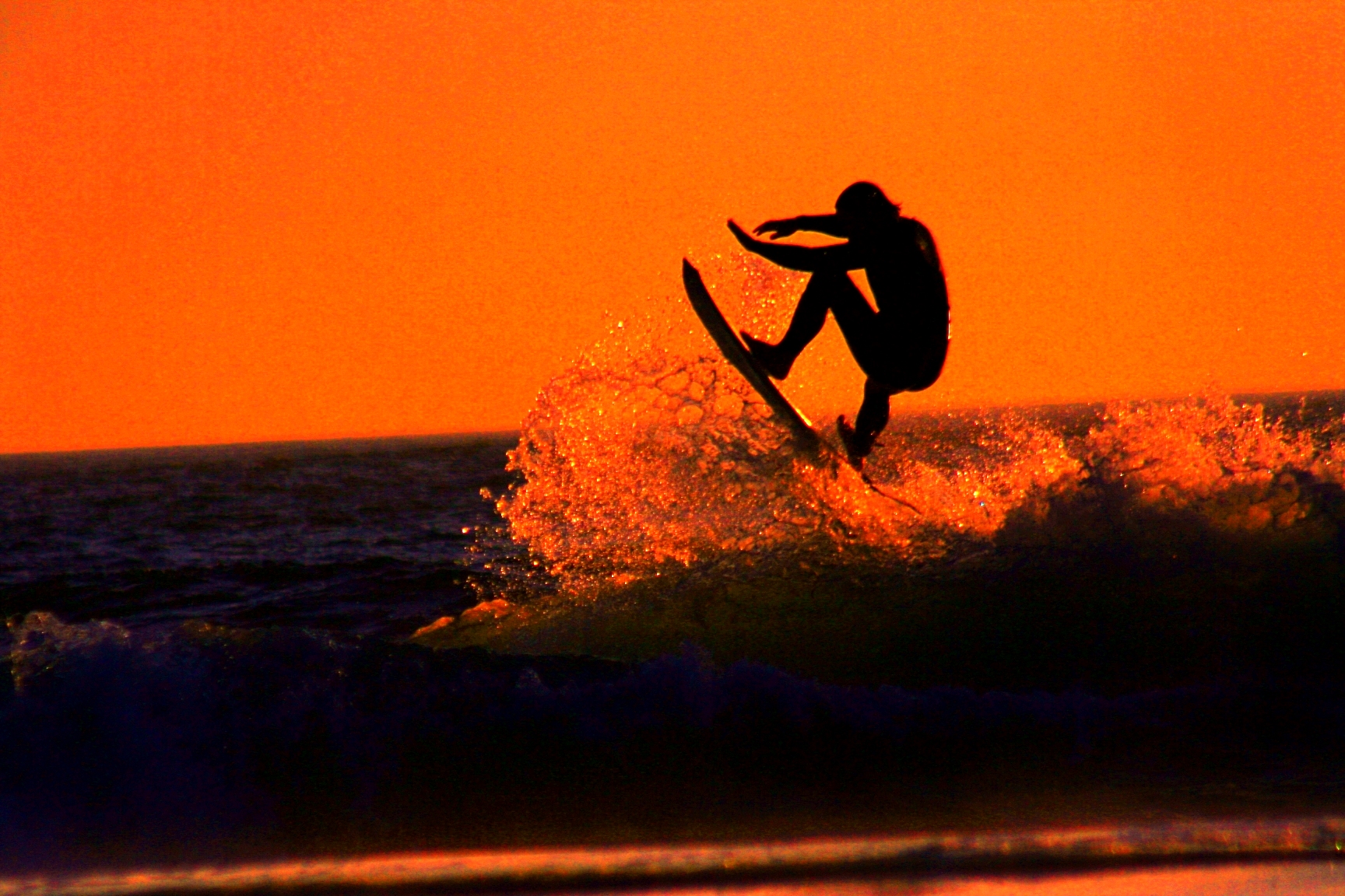 Sunset surfer photo