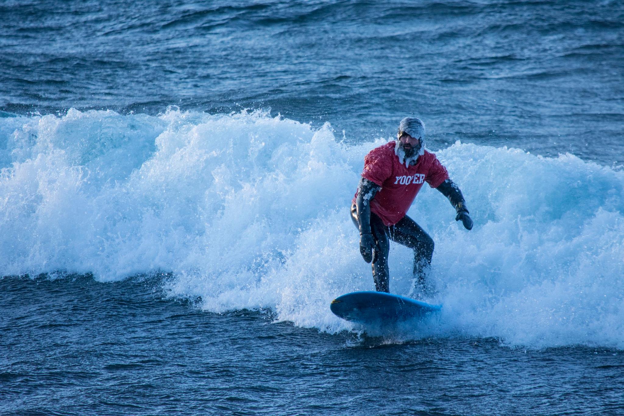 Brutal cold doesn't keep surfer from catching waves on the Great ...