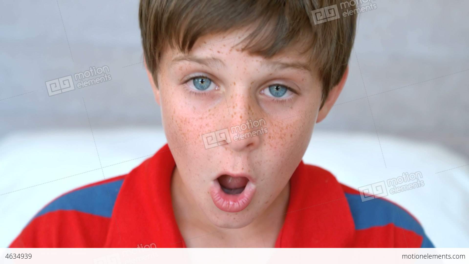 Surprised Blue Eyed Boy Opening His Mouth Stock video footage | 4634939
